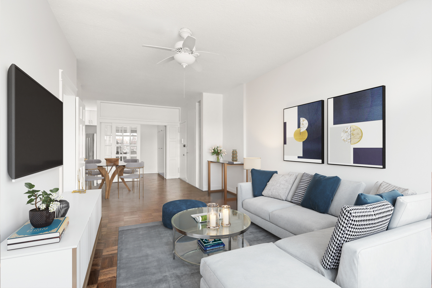 60 East 8th Street, Unit 24J Manhattan, NY 10003 - Photo 3 of 16 a living room with furniture and a flat screen tv