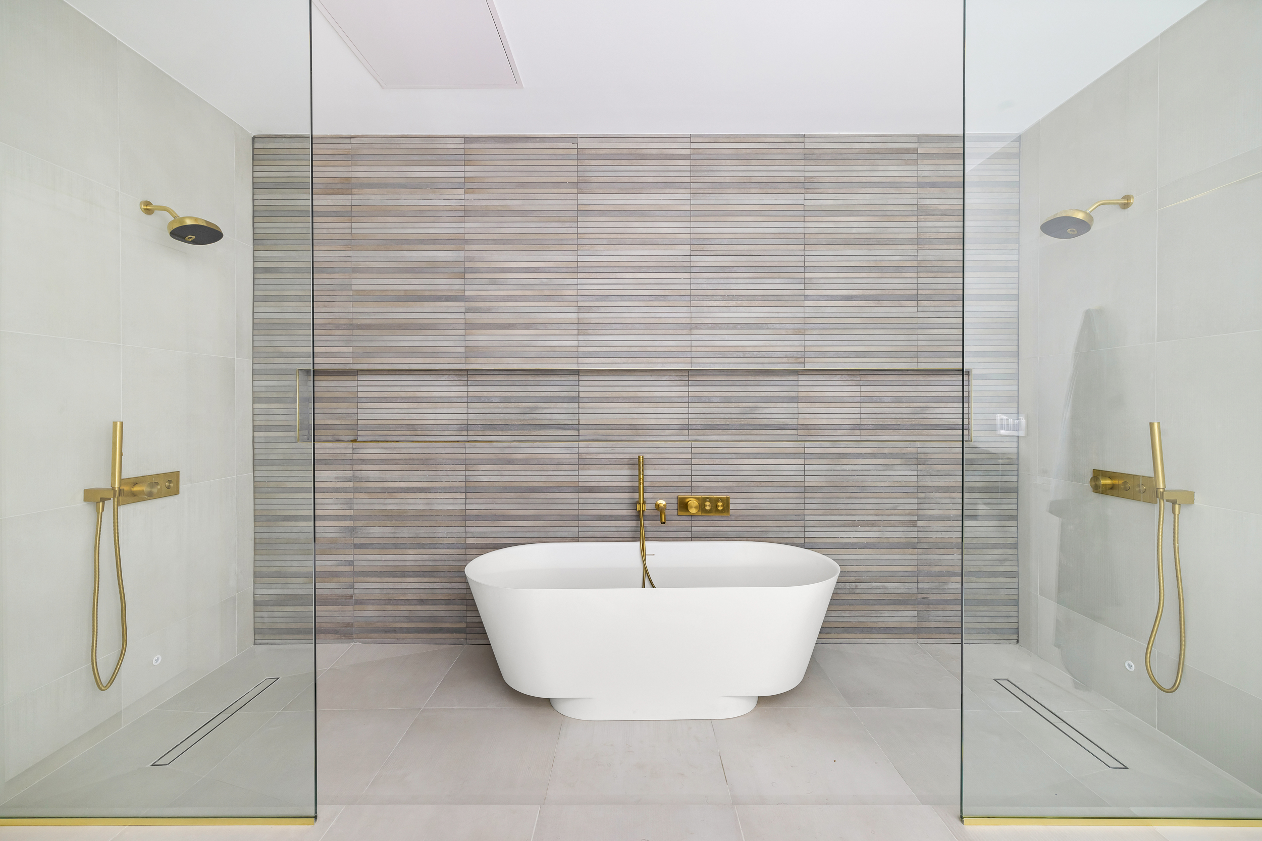 442 West 22nd Street Manhattan, NY 10011 - Photo 14 of 17 a bathroom with a bathtub and shower