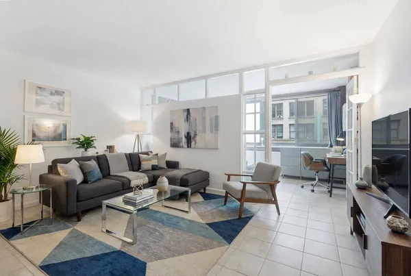 a living room with furniture and a flat screen tv