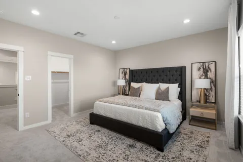 a bedroom with a bed and a view of bathroom