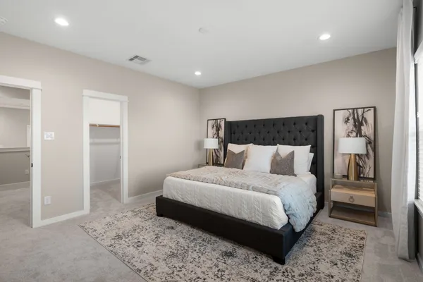 a bedroom with a bed and a view of bathroom