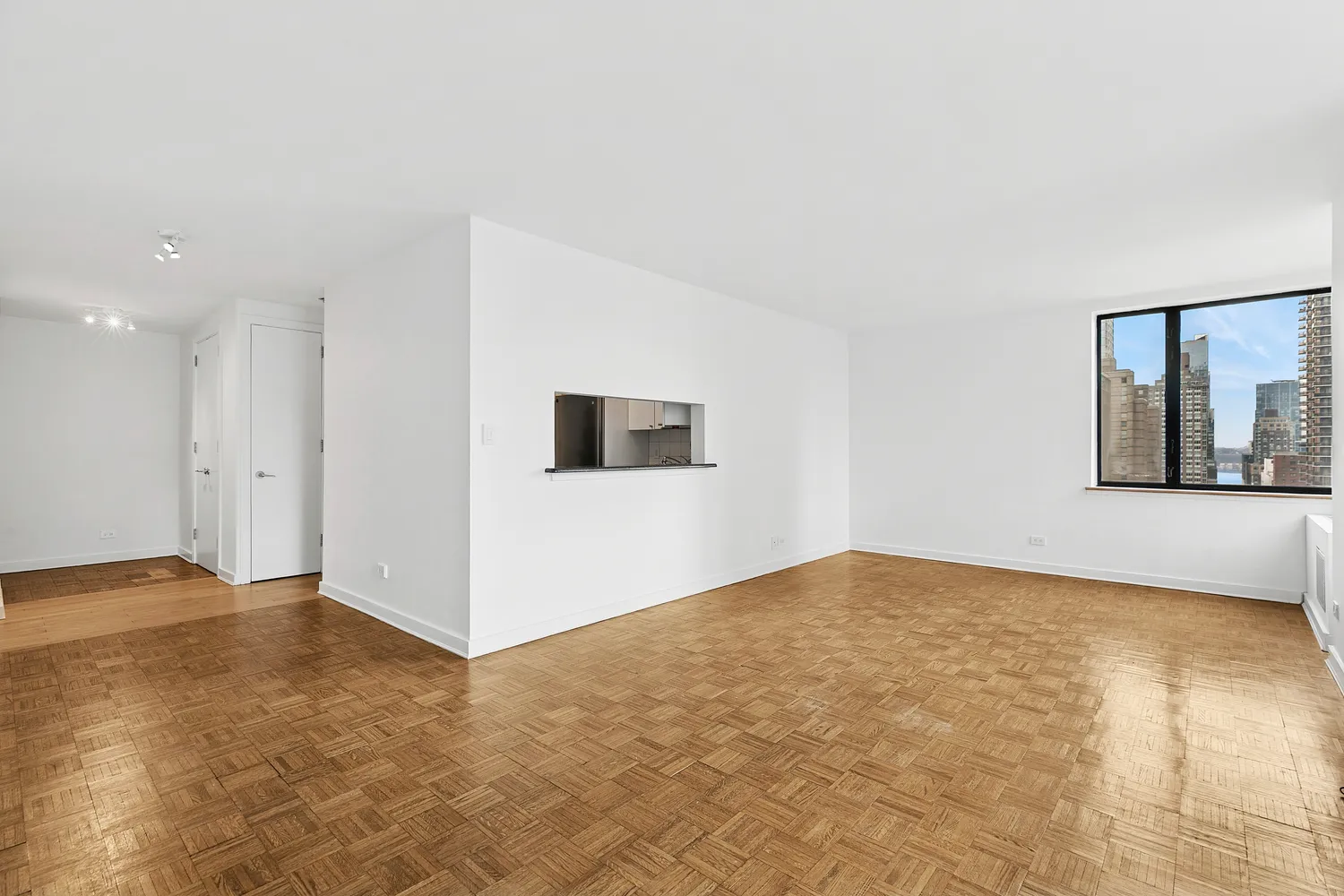 a view of an empty room with a window