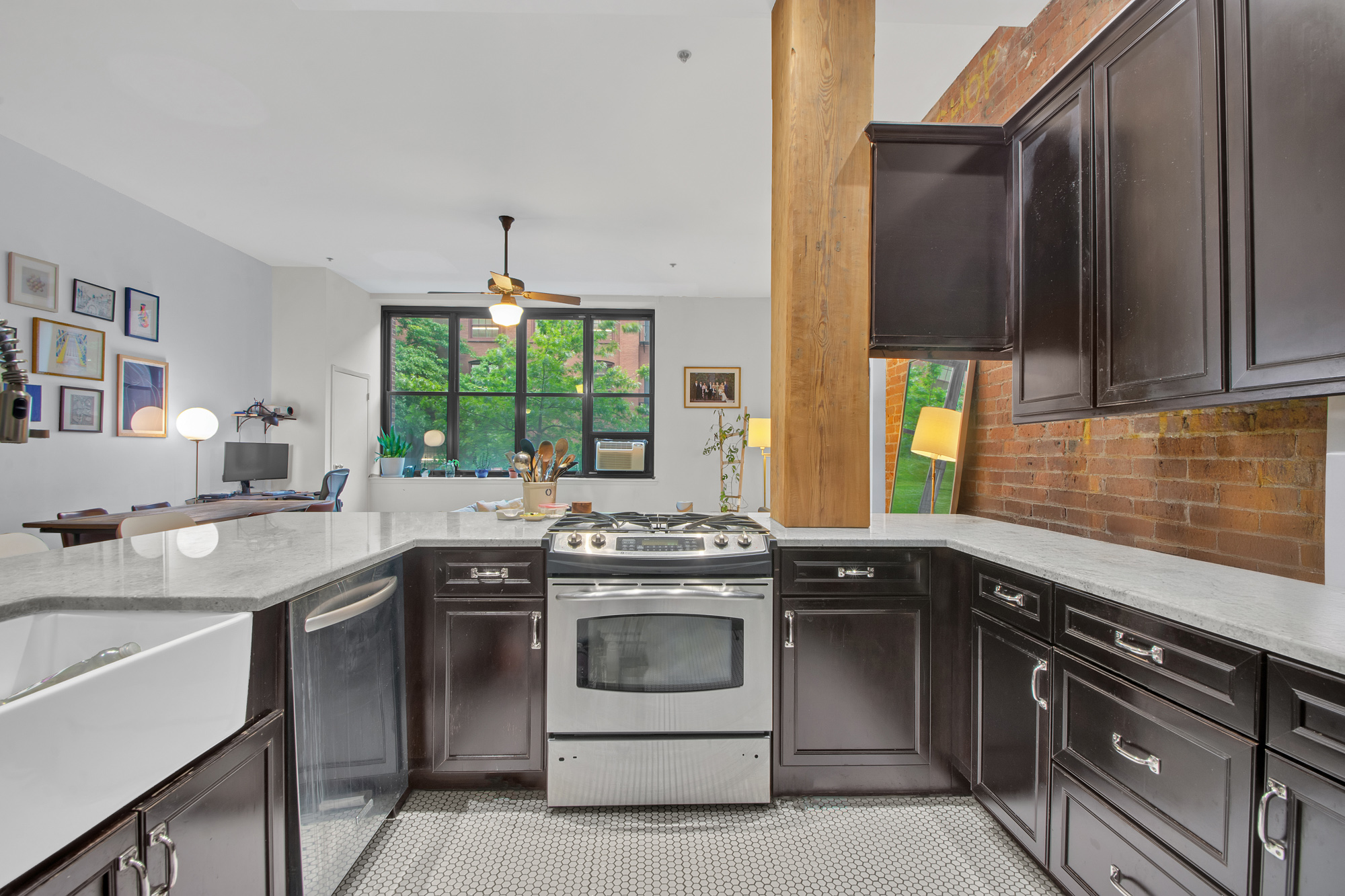 372 Dekalb Avenue, Unit 2H Brooklyn, NY 11205 - Photo 4 of 9 a kitchen with a stove sink and window
