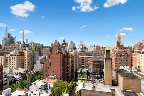 a view of a city with tall buildings