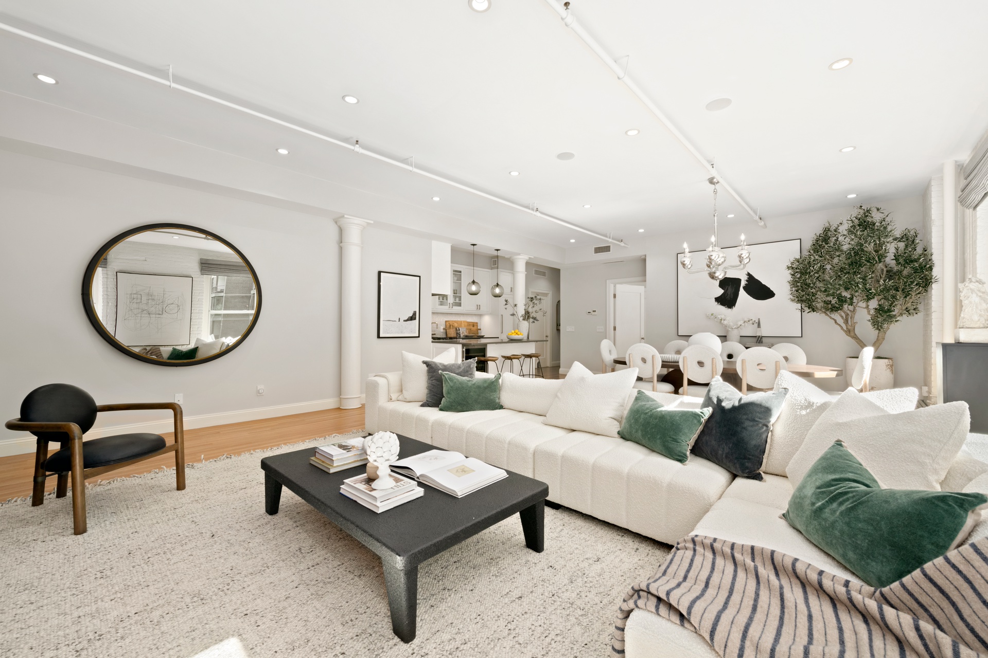 30 West 13th Street, Unit 4C Manhattan, NY 10011 - Photo 8 of 22 a living room with furniture a mirror and a large window