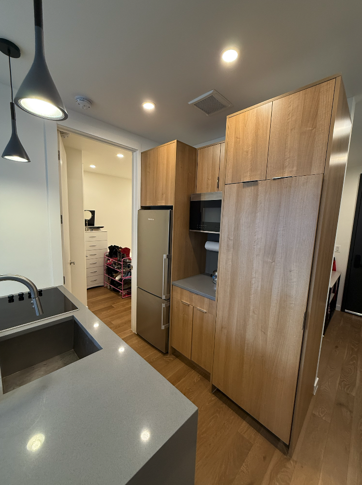 34 Carmine Street, Unit 2D Manhattan, NY 10014 - Photo 8 of 8 a kitchen with refrigerator and car