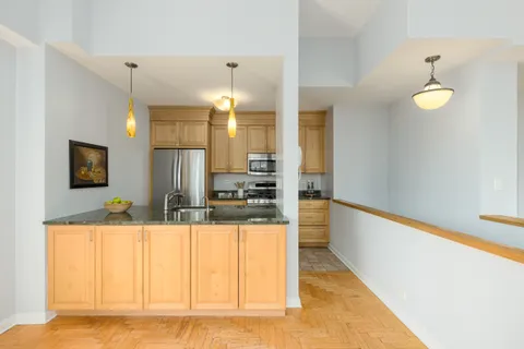 a view of a living room with a flat screen tv