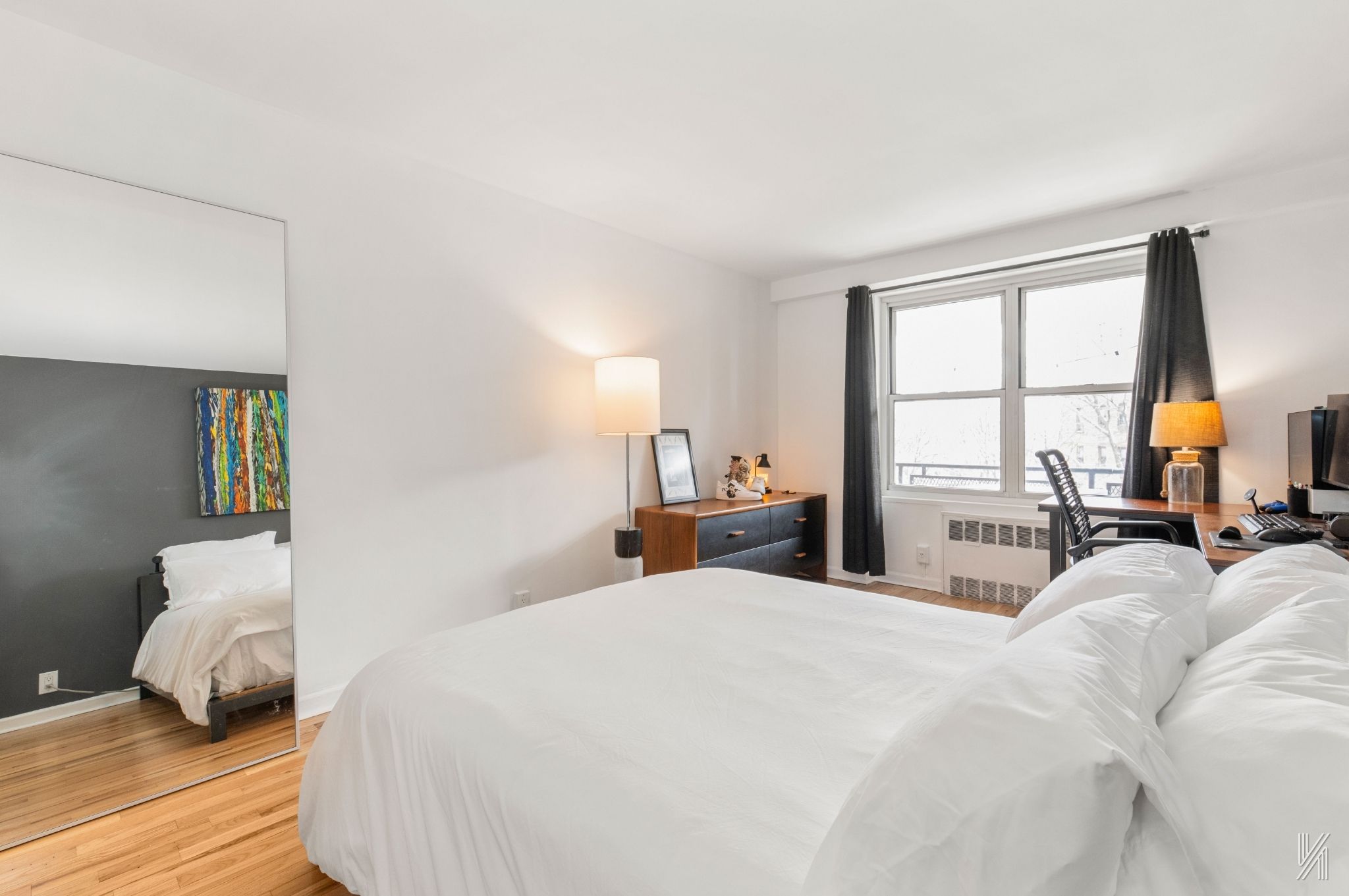 35-50 85th Street, Unit 7H Queens, NY 11372 - Photo 10 of 16 a bedroom with a large bed and a large window