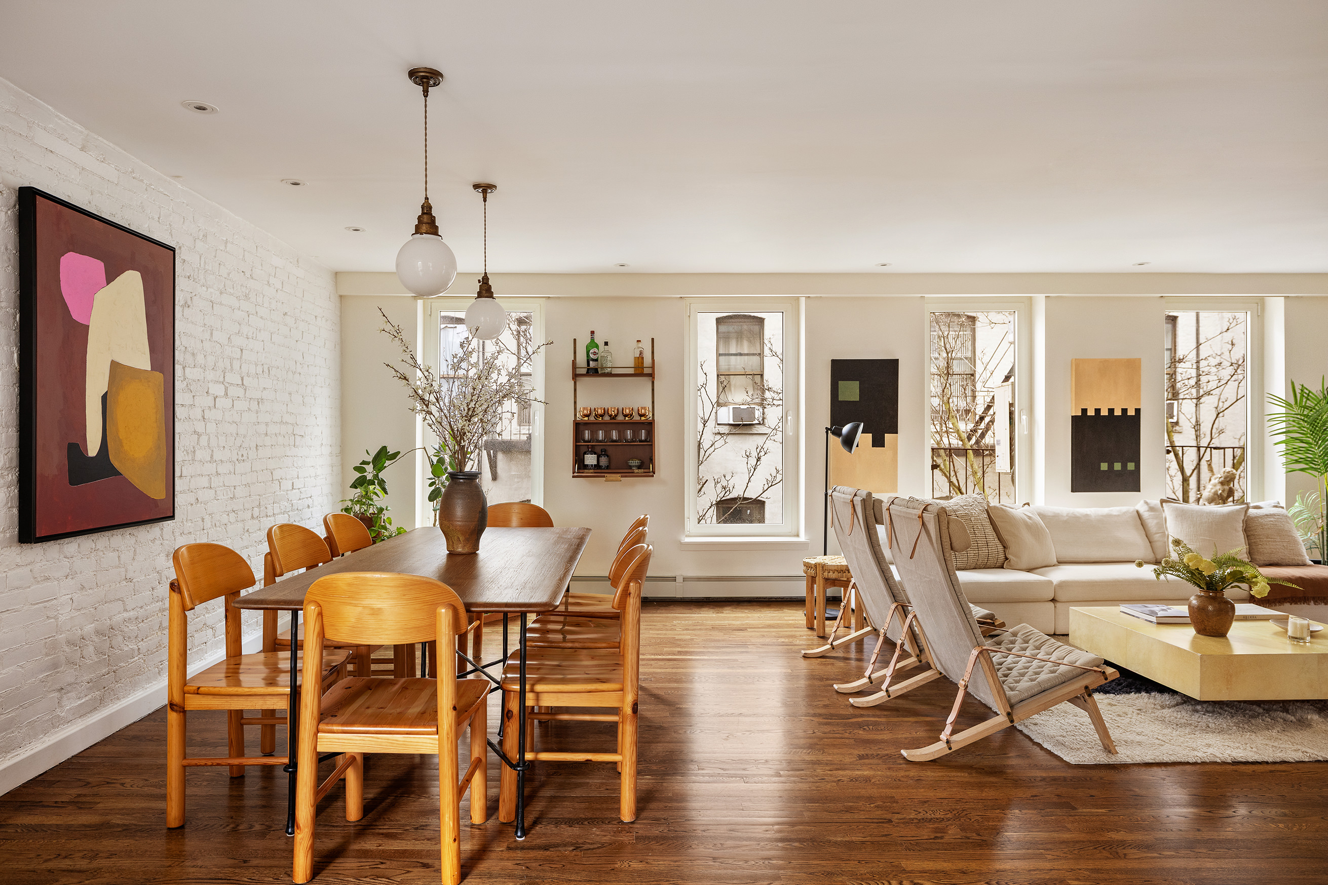 211 East 3rd Street, Unit 5R Manhattan, NY 10009 - Photo 5 of 16 a view of a dining room with furniture window and wooden floor
