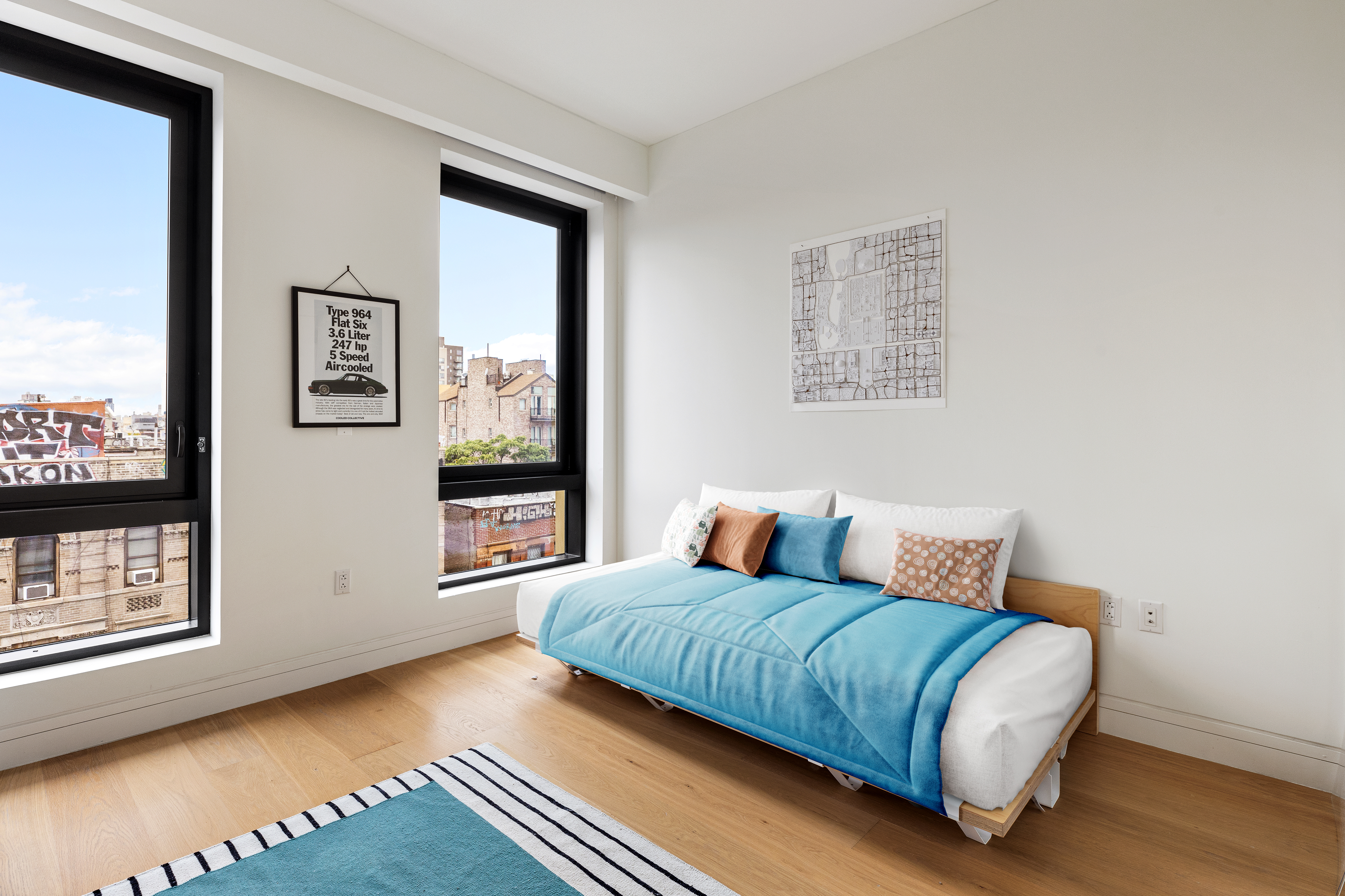 242 Broome Street, Unit 7C Manhattan, NY 10002 - Photo 5 of 7 a bedroom with a bed and a large window