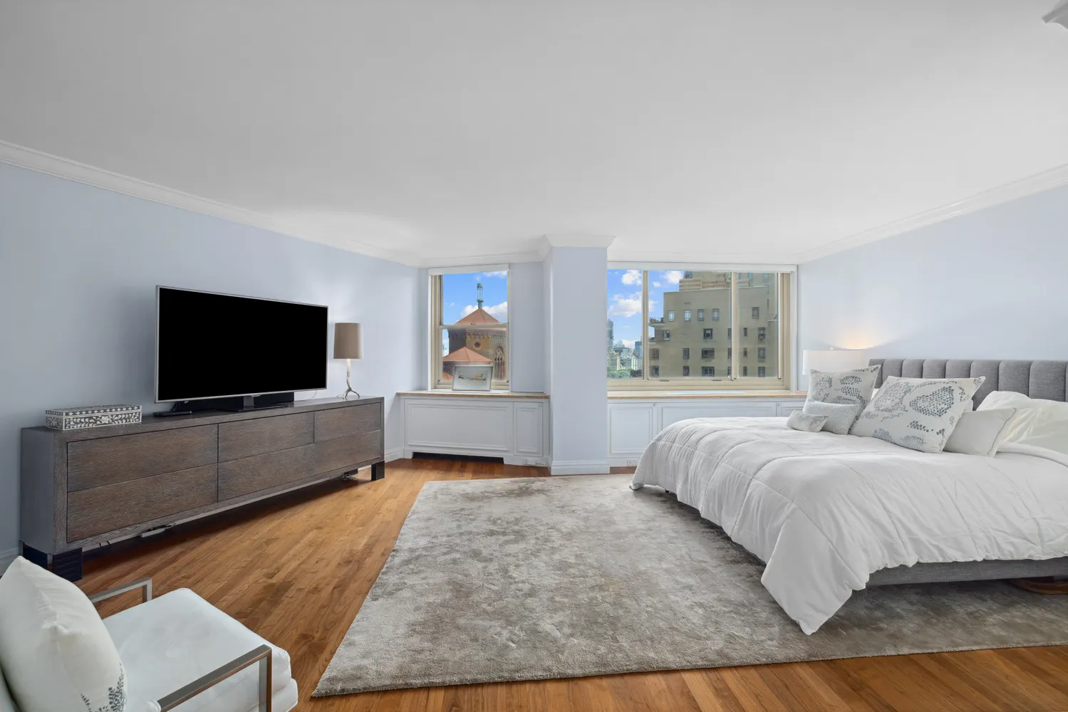 a living room with a flat screen tv and a couch