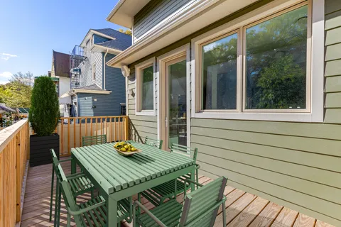 a balcony view with a seating space