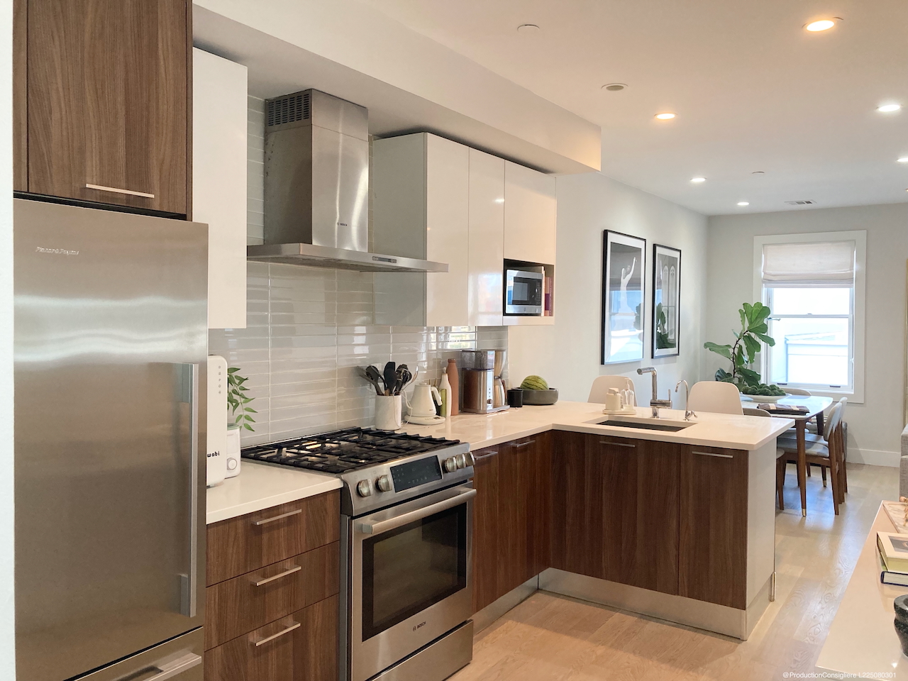 139-141 West 126th Street, Unit 4B Manhattan, NY 10027 - Photo 3 of 13 a kitchen with stainless steel appliances a sink stove and cabinets