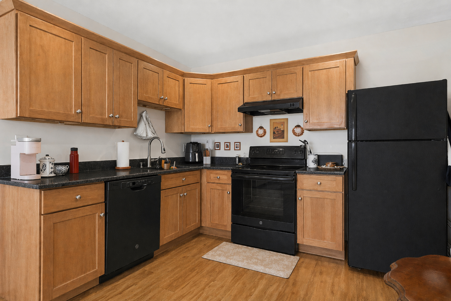 197 Calumet Street, Unit 10 Boston, MA 02120 - Photo 3 of 10 a kitchen with a refrigerator and a stove top oven
