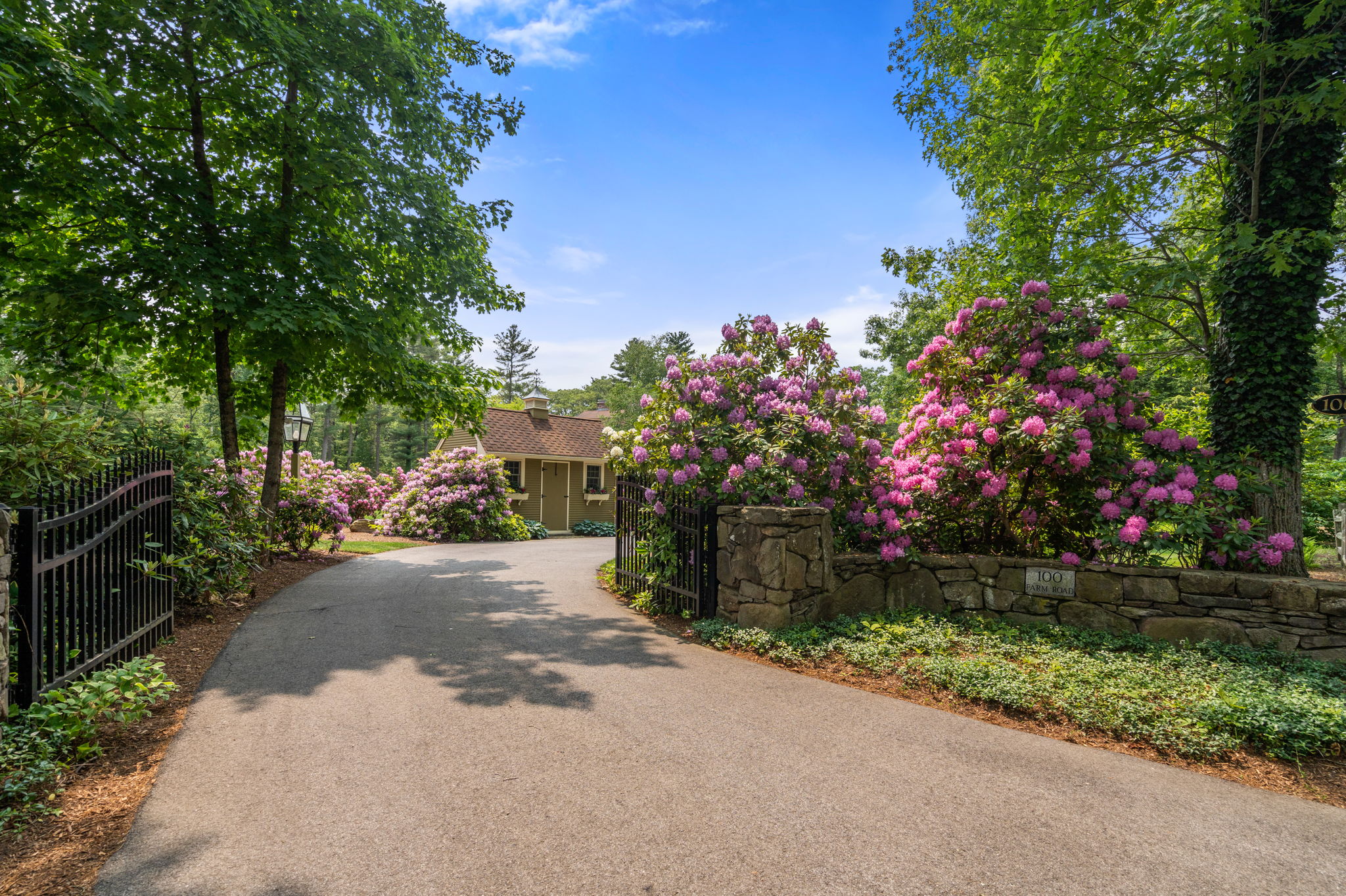100 Farm Road Sherborn, MA 01770 - Photo 6 of 17 a view of a street with flower plants in front of main door