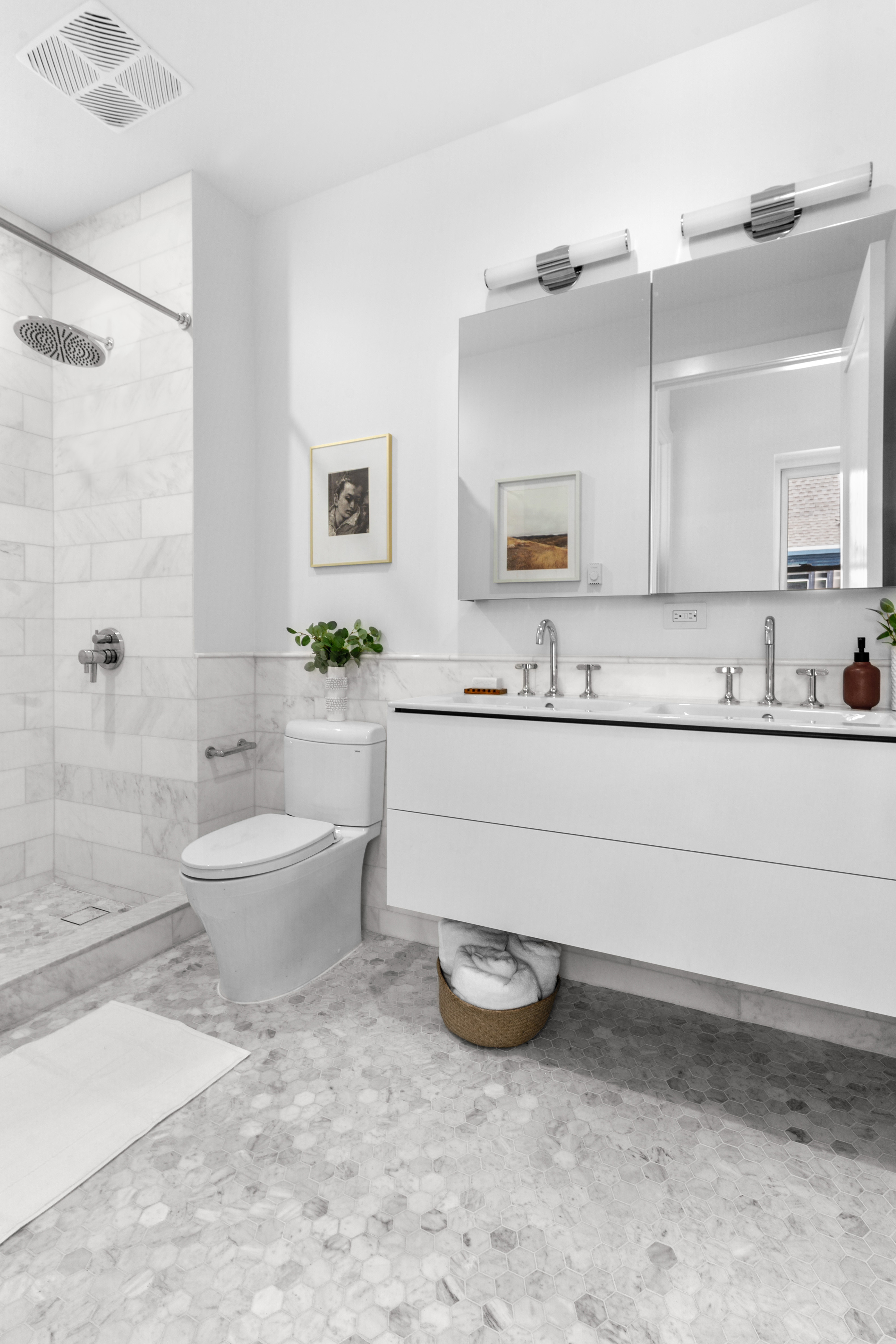 1370 Dean Street, Unit PHD Brooklyn, NY 11216 - Photo 7 of 12 a bathroom with a sink a toilet and shower
