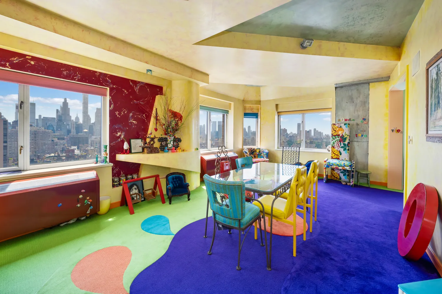 a living room with furniture and a dining table