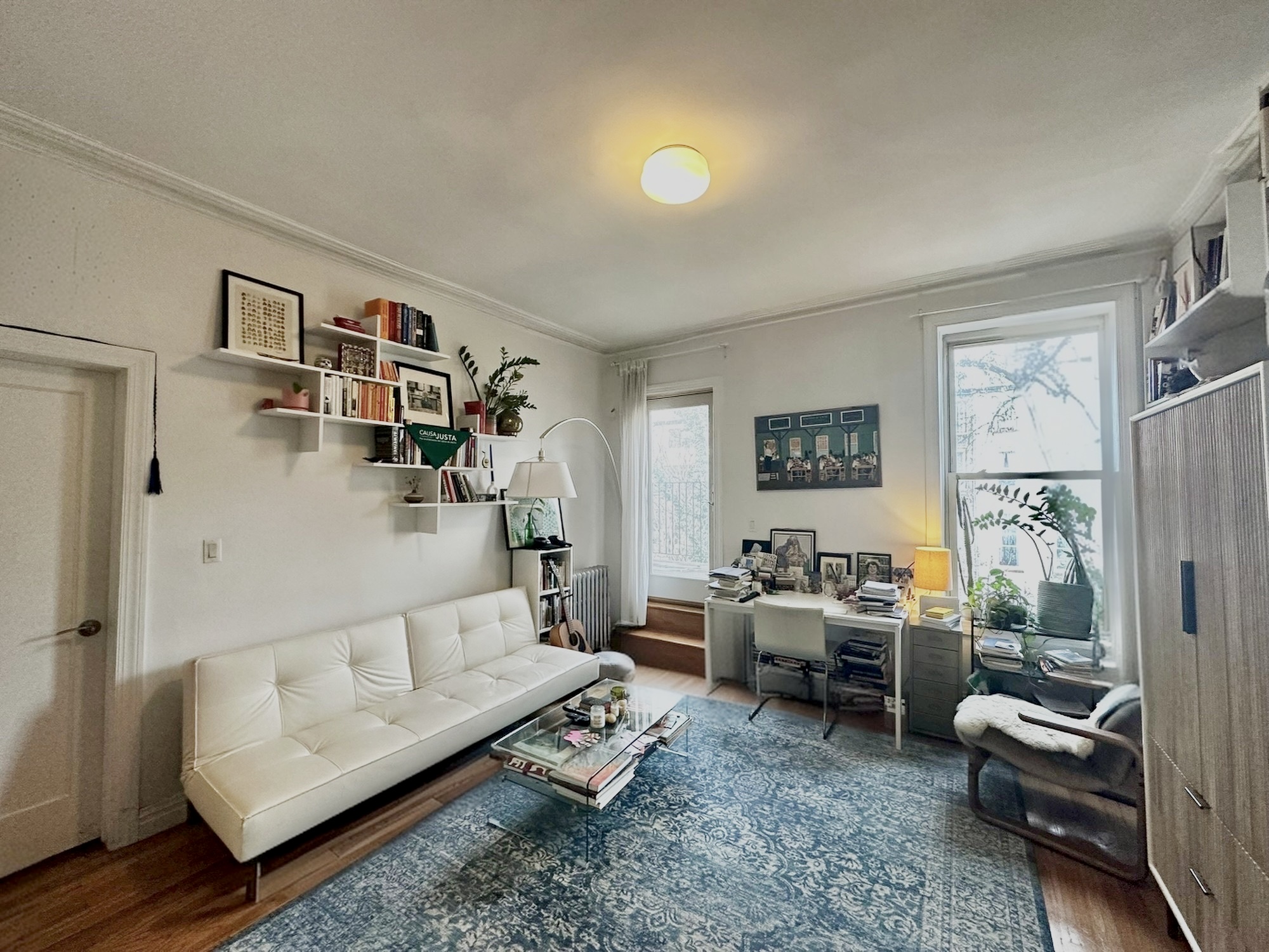 89 Wyckoff Street, Unit 3B Brooklyn, NY 11201 - Photo 3 of 8 a living room with furniture and a window