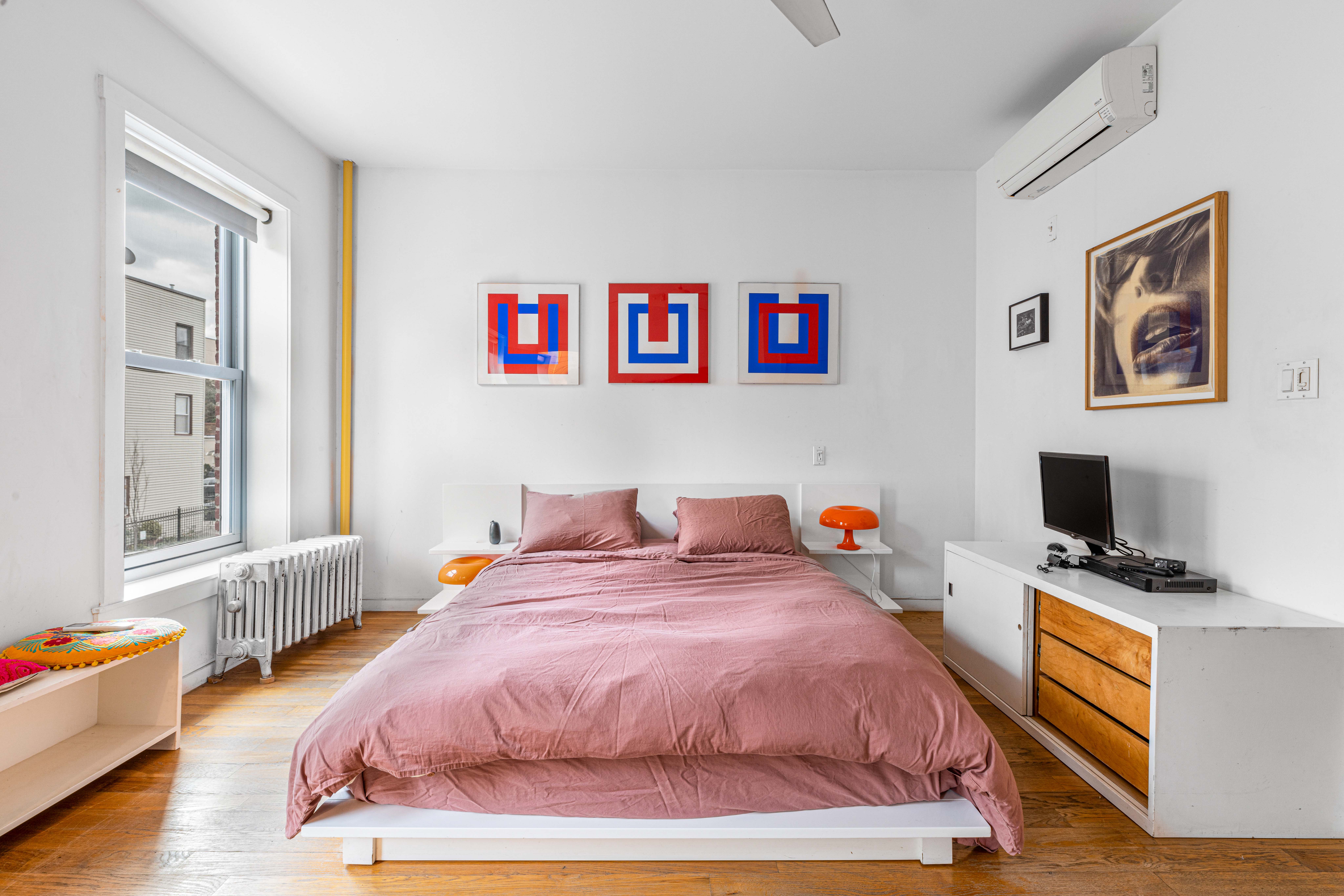 209 Calyer Street, Unit 2 Brooklyn, NY 11222 - Photo 9 of 17 a bedroom with bed and a flat screen tv