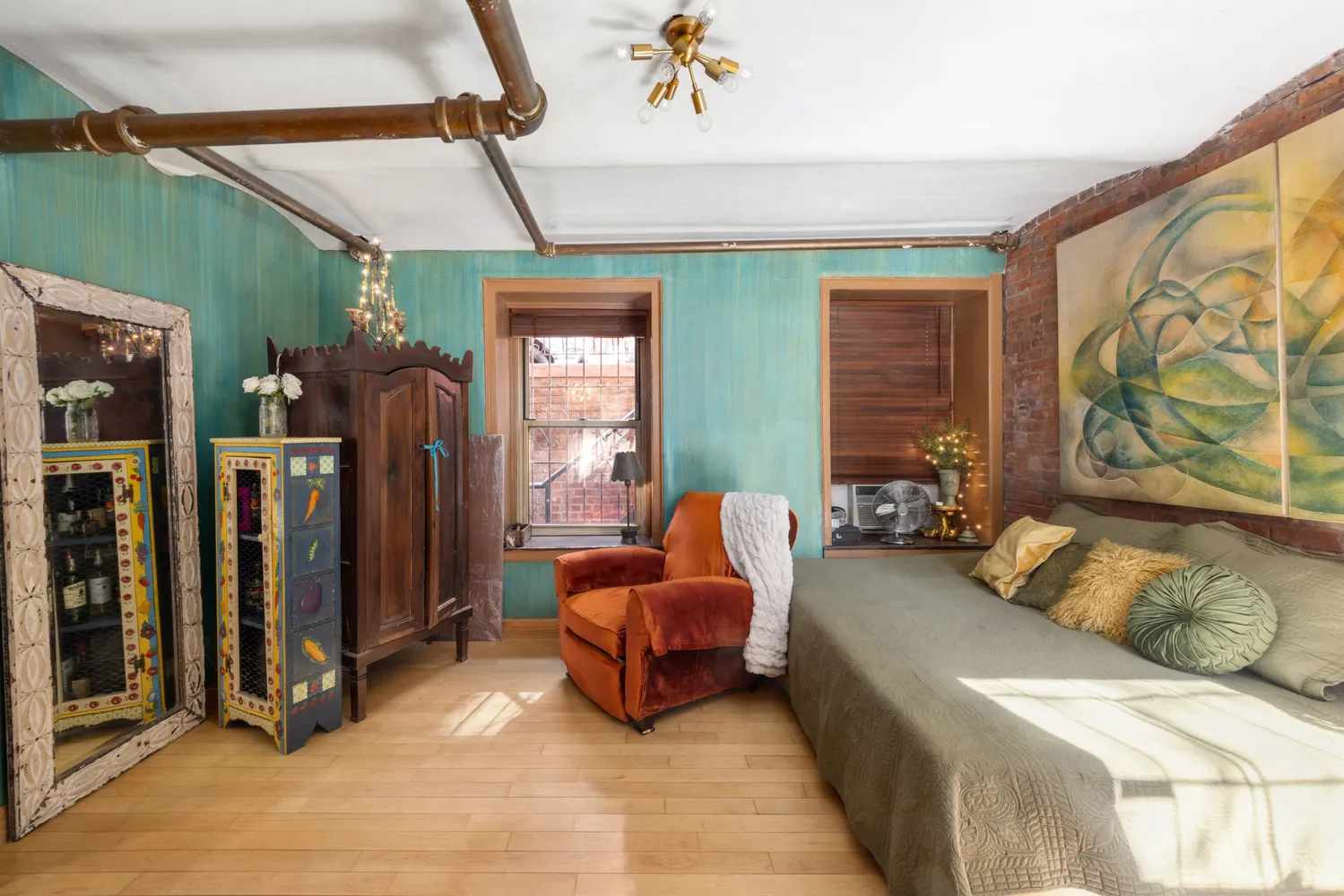 a living room with furniture and large windows