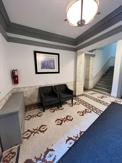 a bedroom with a bed and a table in it