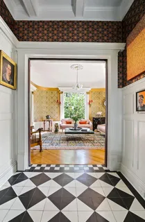 a view of a living room and a floor to ceiling window