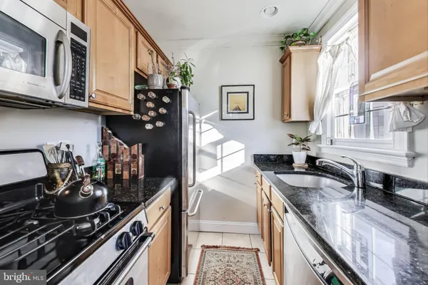 a kitchen with a stove and a microwave