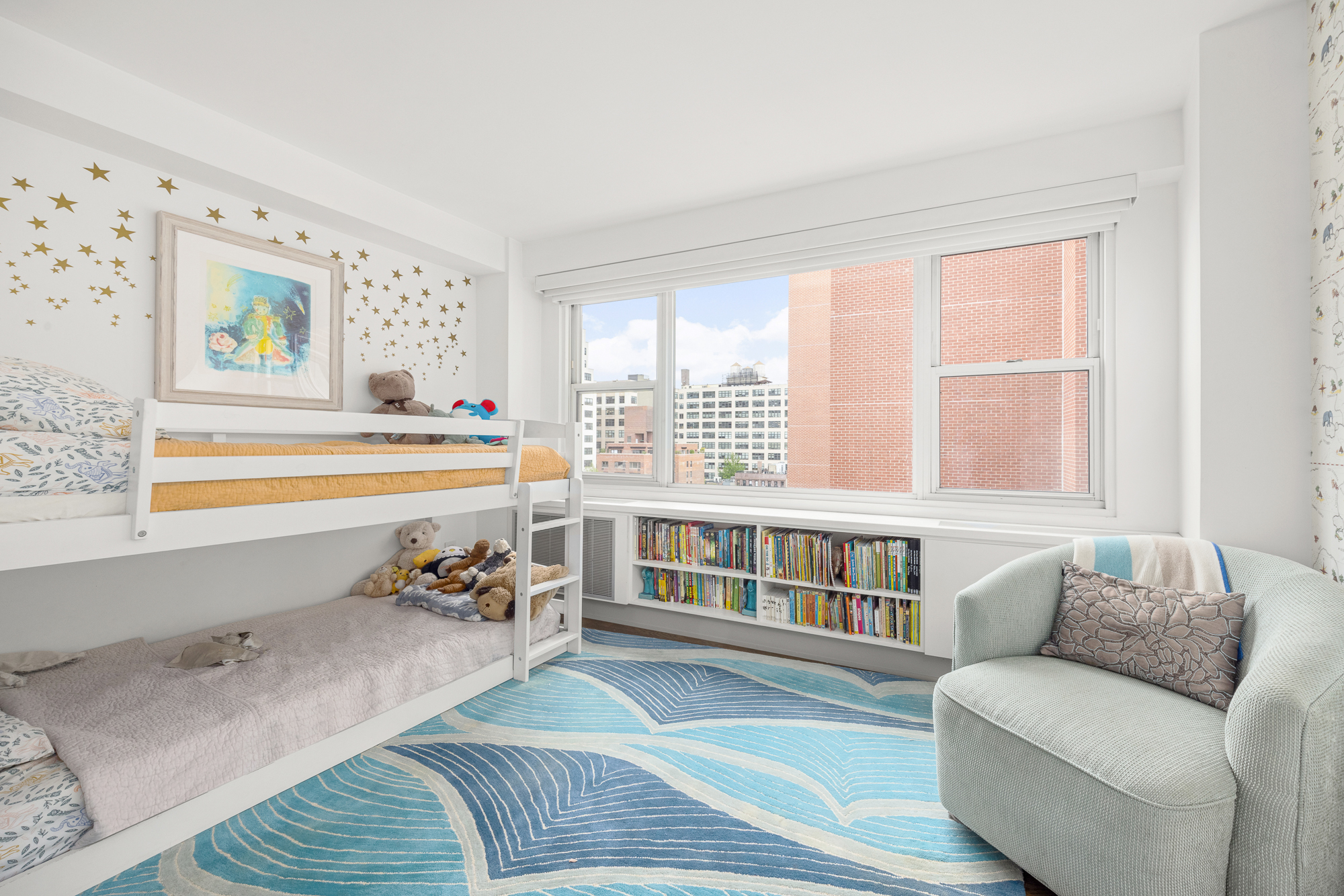 2 Charlton Street, Unit 11LM Manhattan, NY 10014 - Photo 10 of 16 a living room with furniture and a large window