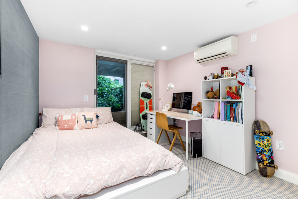 308 West 19th Street, Unit GARDEN Manhattan, NY 10011 - Photo 15 of 18 a bedroom with a bed and a large mirror