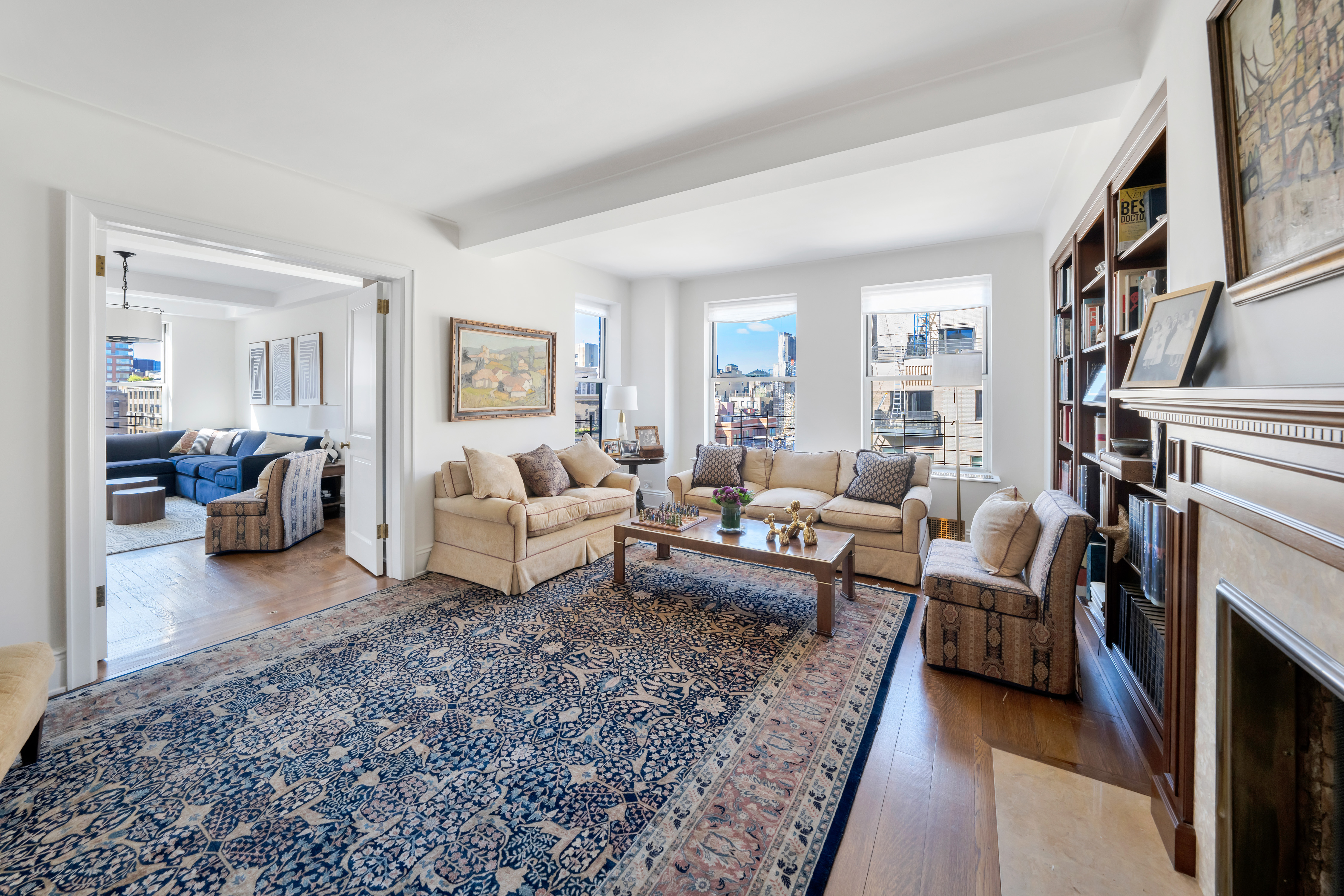 47 East 88th Street, Unit 15A Manhattan, NY 10128 - Photo 2 of 21 a living room with furniture and a fireplace