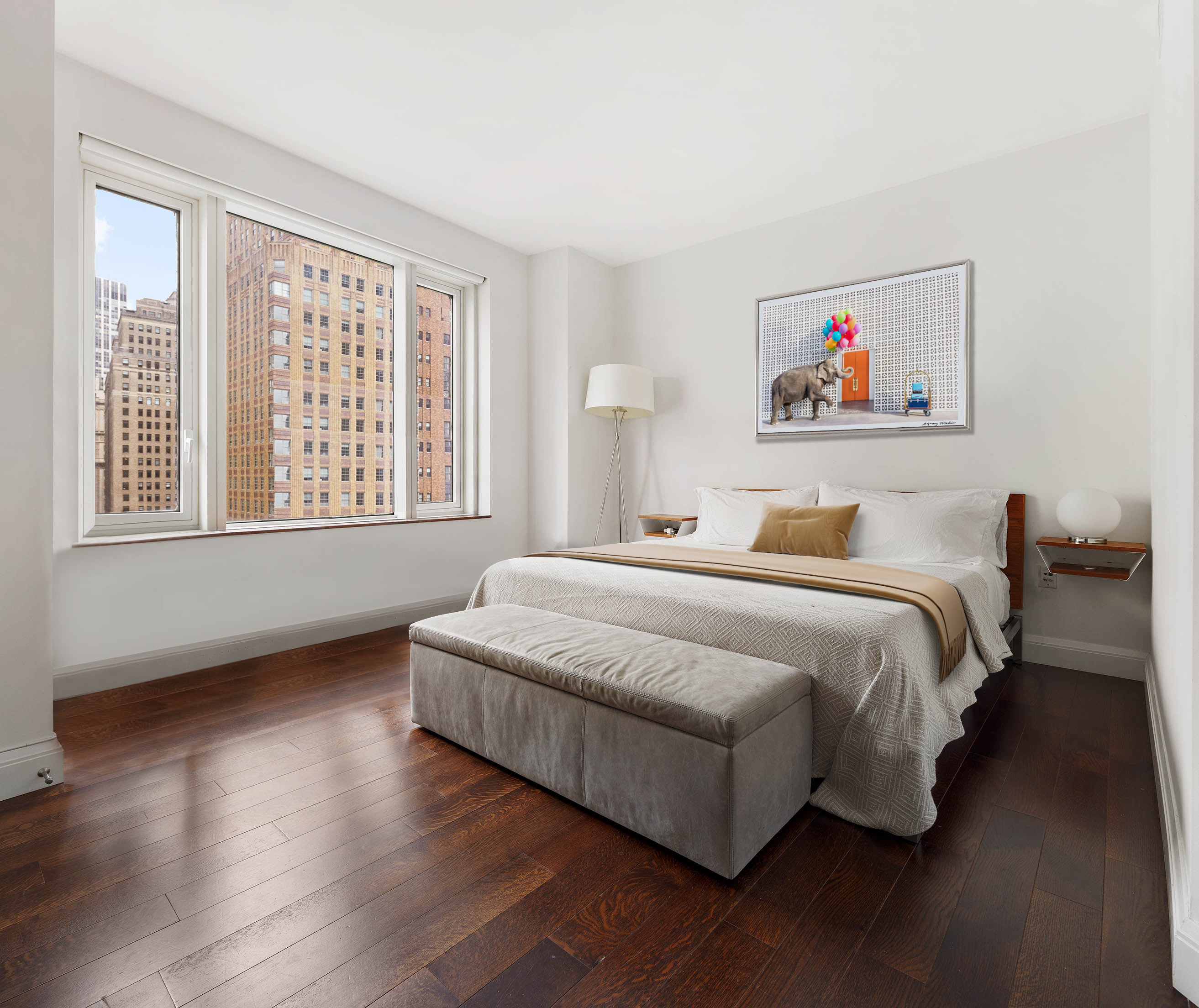 70 Little West Street, Unit 14B Manhattan, NY 10004 - Photo 4 of 17 a spacious bedroom with a bed and a large window
