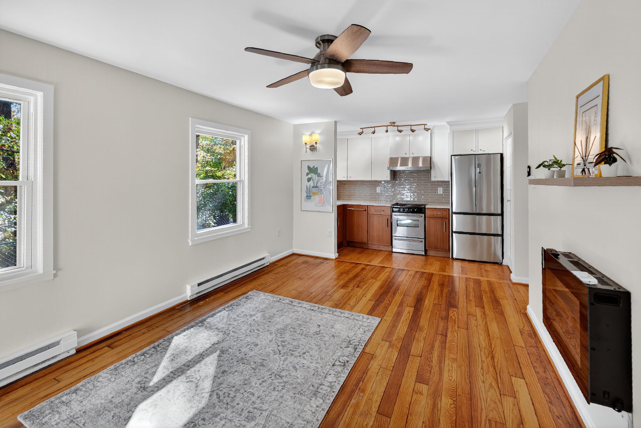 20 F Hillside Road Greenbelt, MD 20770 - Photo 3 of 4 a living room with stainless steel appliances granite countertop furniture wooden floor and a window