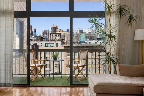 a view of a balcony with a swimming pool