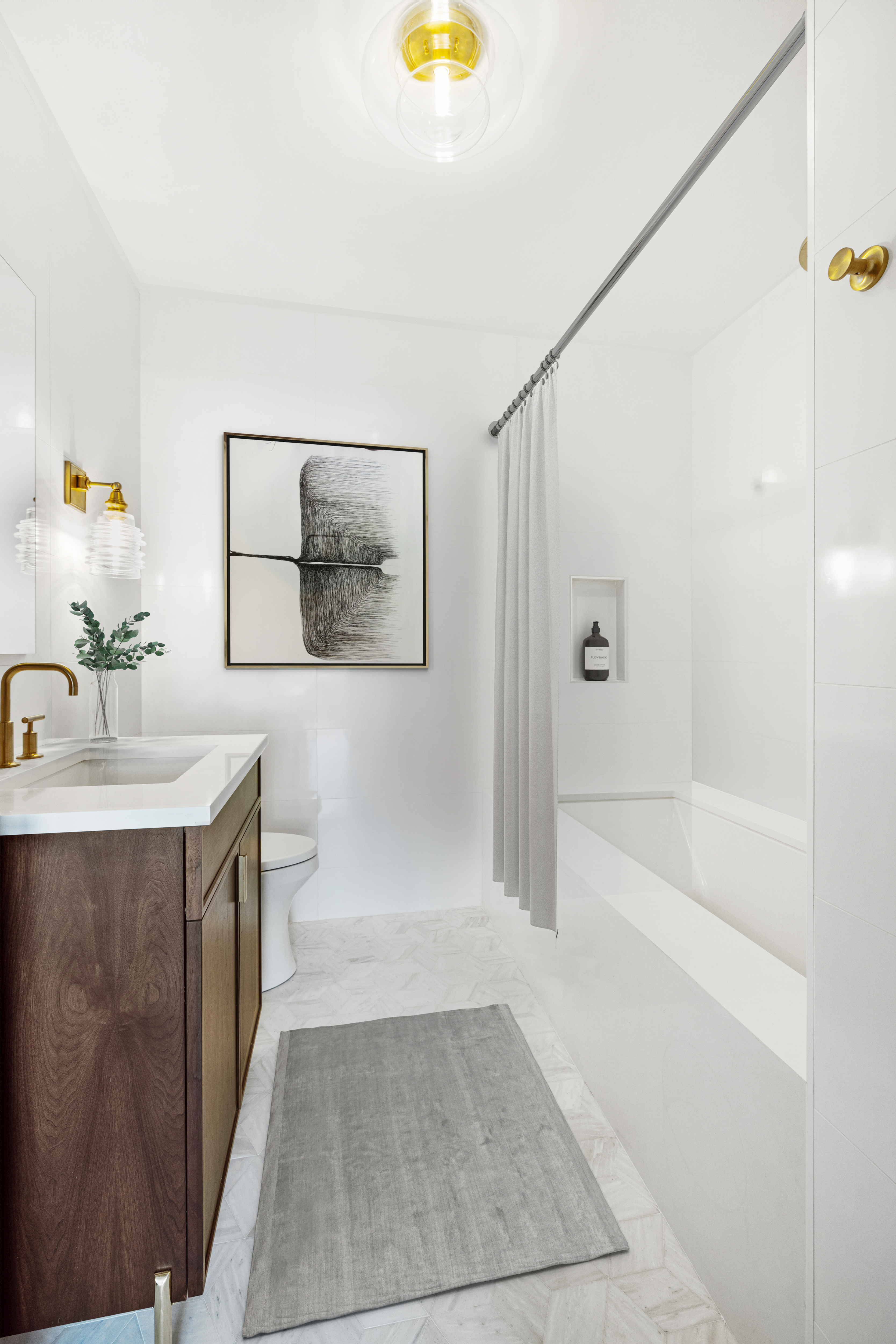 63 West 17th Street, Unit 7A Manhattan, NY 10011 - Photo 27 of 32 a bathroom with a sink a toilet and shower