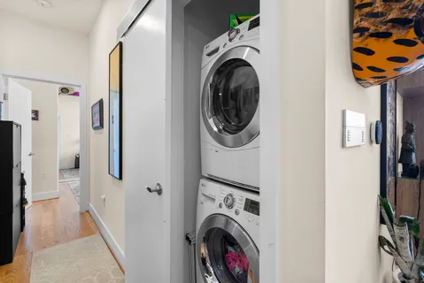 a view of a hallway with washer and dryer