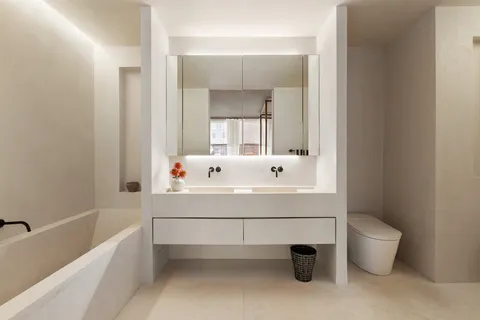 a bathroom with a bathtub sink and toilet