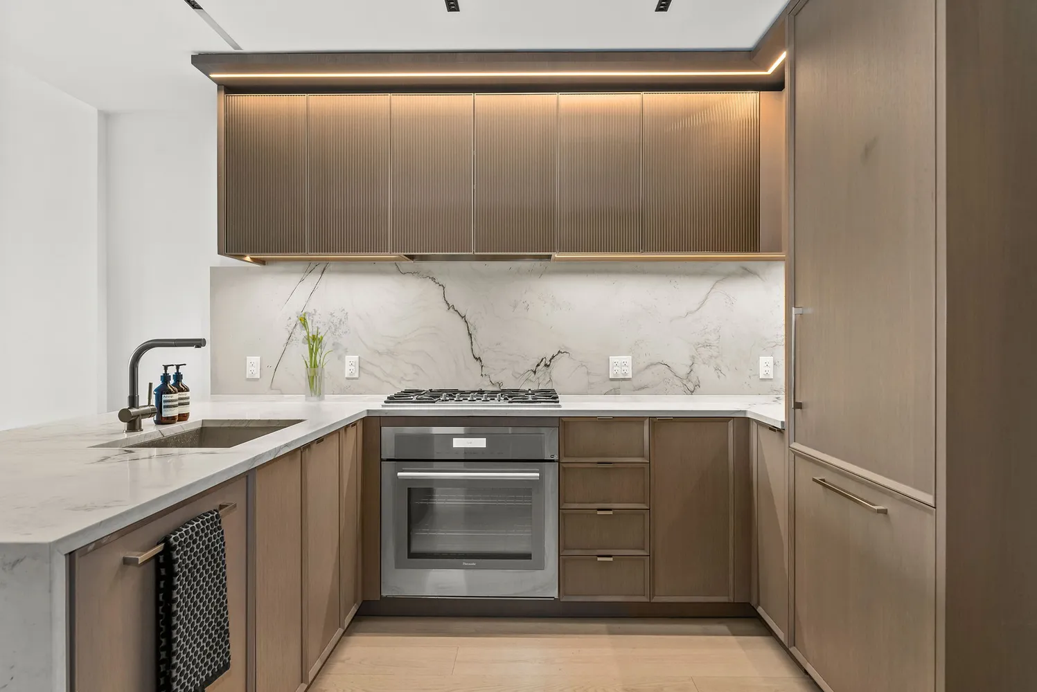 a kitchen with a sink and cabinets