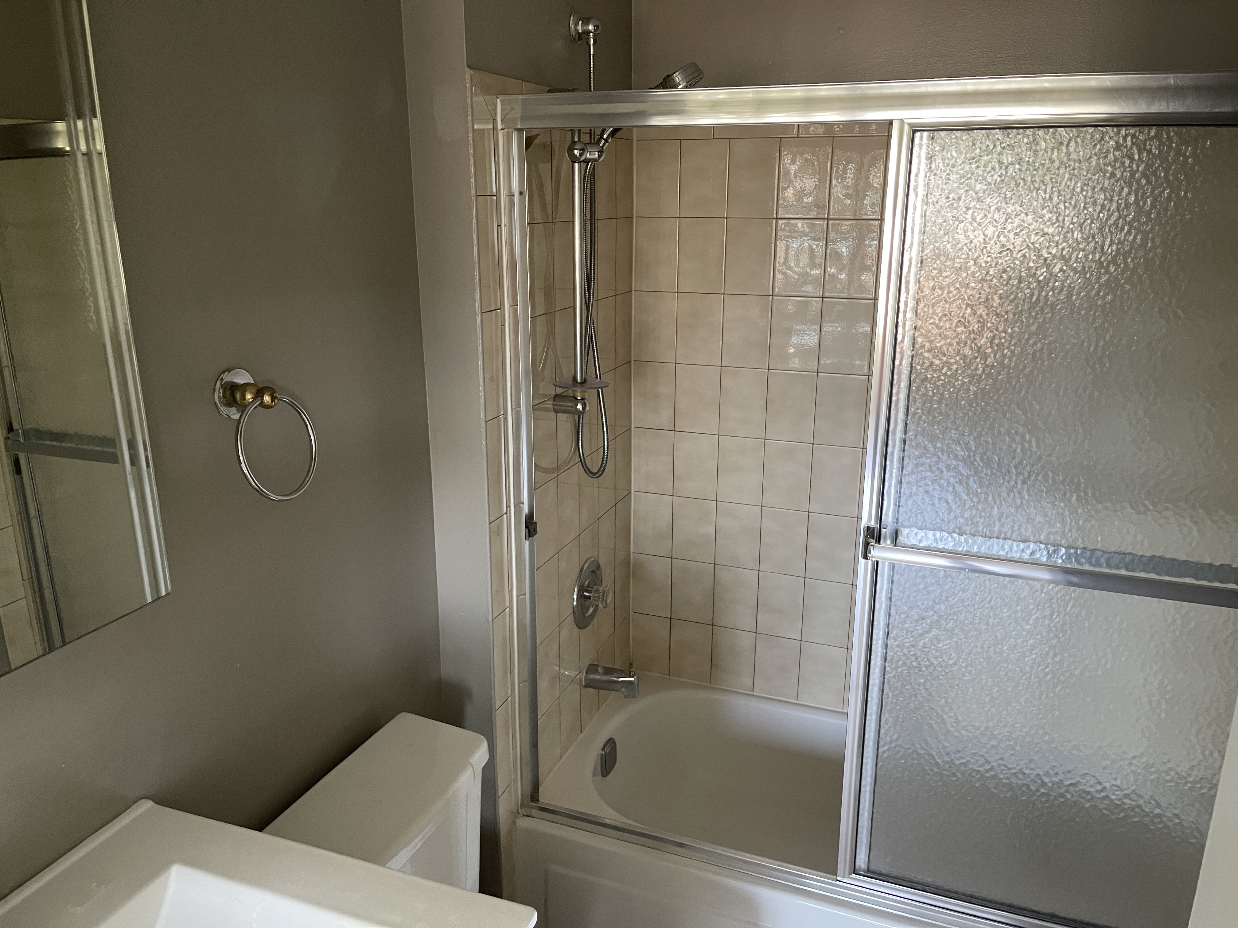 25-40 Shore Boulevard, Unit 6F Queens, NY 11102 - Photo 8 of 17 a bathroom with a shower and a toilet