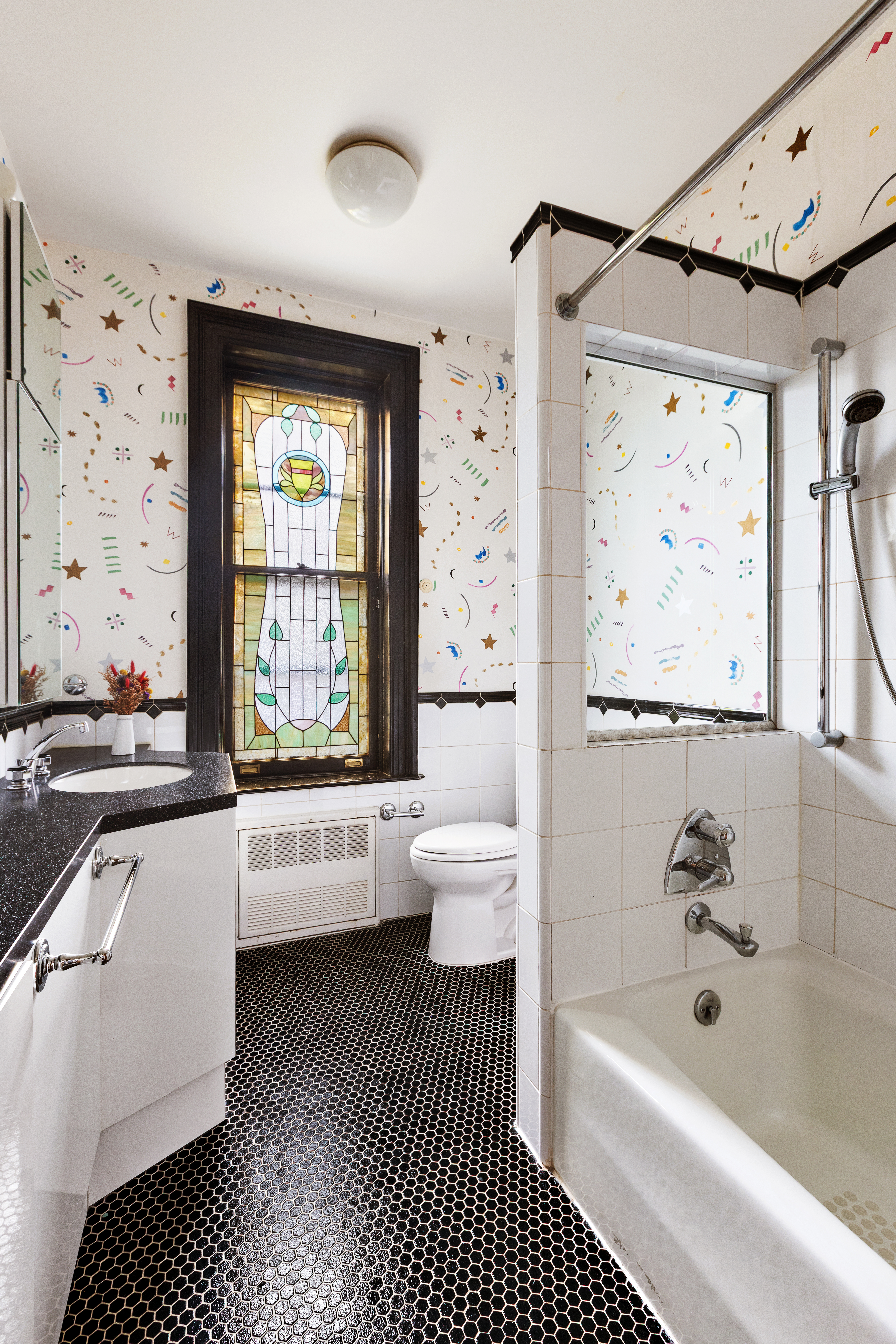 623 2nd Street Brooklyn, NY 11215 - Photo 17 of 26 a bathroom with a bathtub sink and toilet