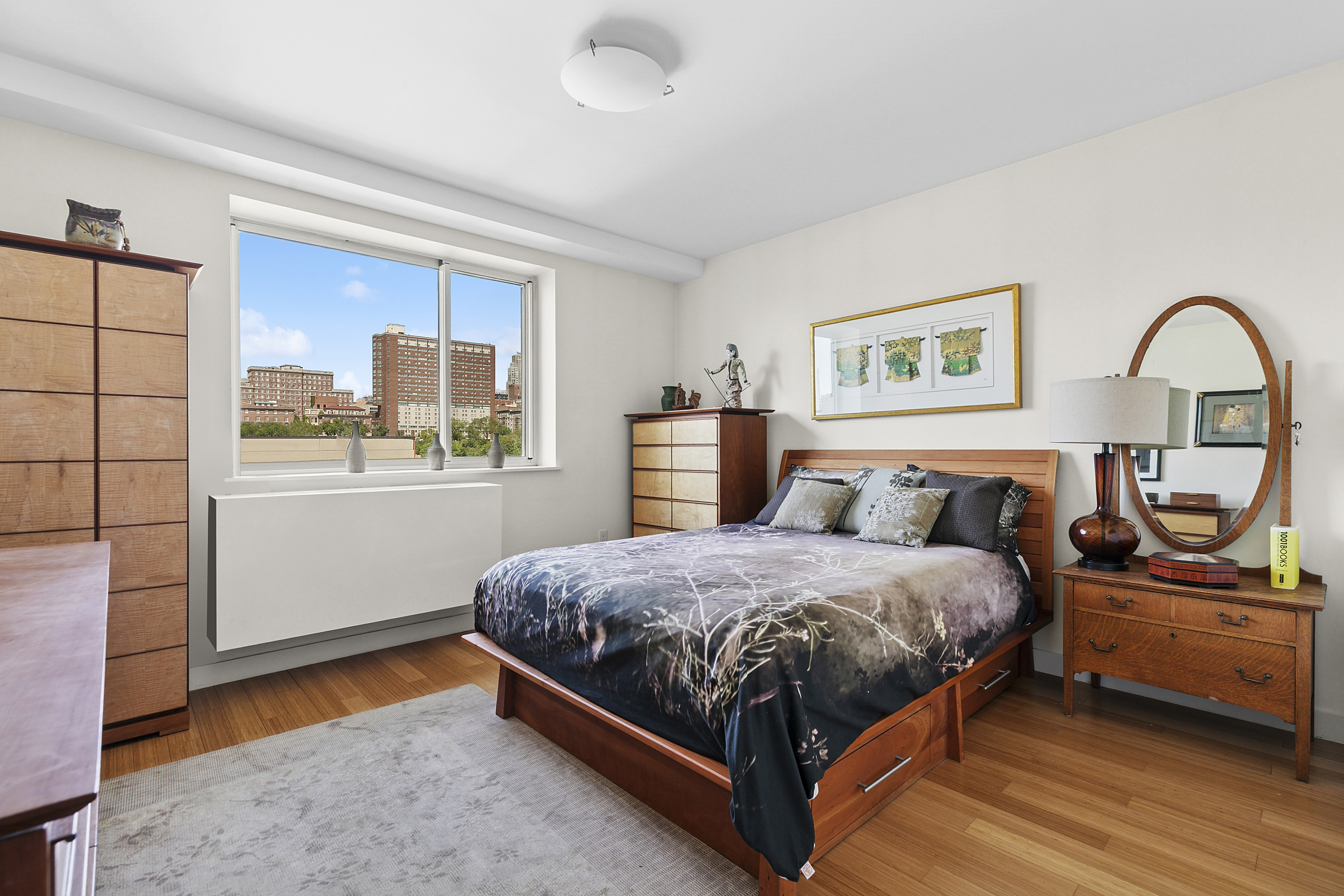 301 West 115th Street, Unit PH1C Manhattan, NY 10026 - Photo 7 of 12 a bedroom with a bed and a large window with the outer view