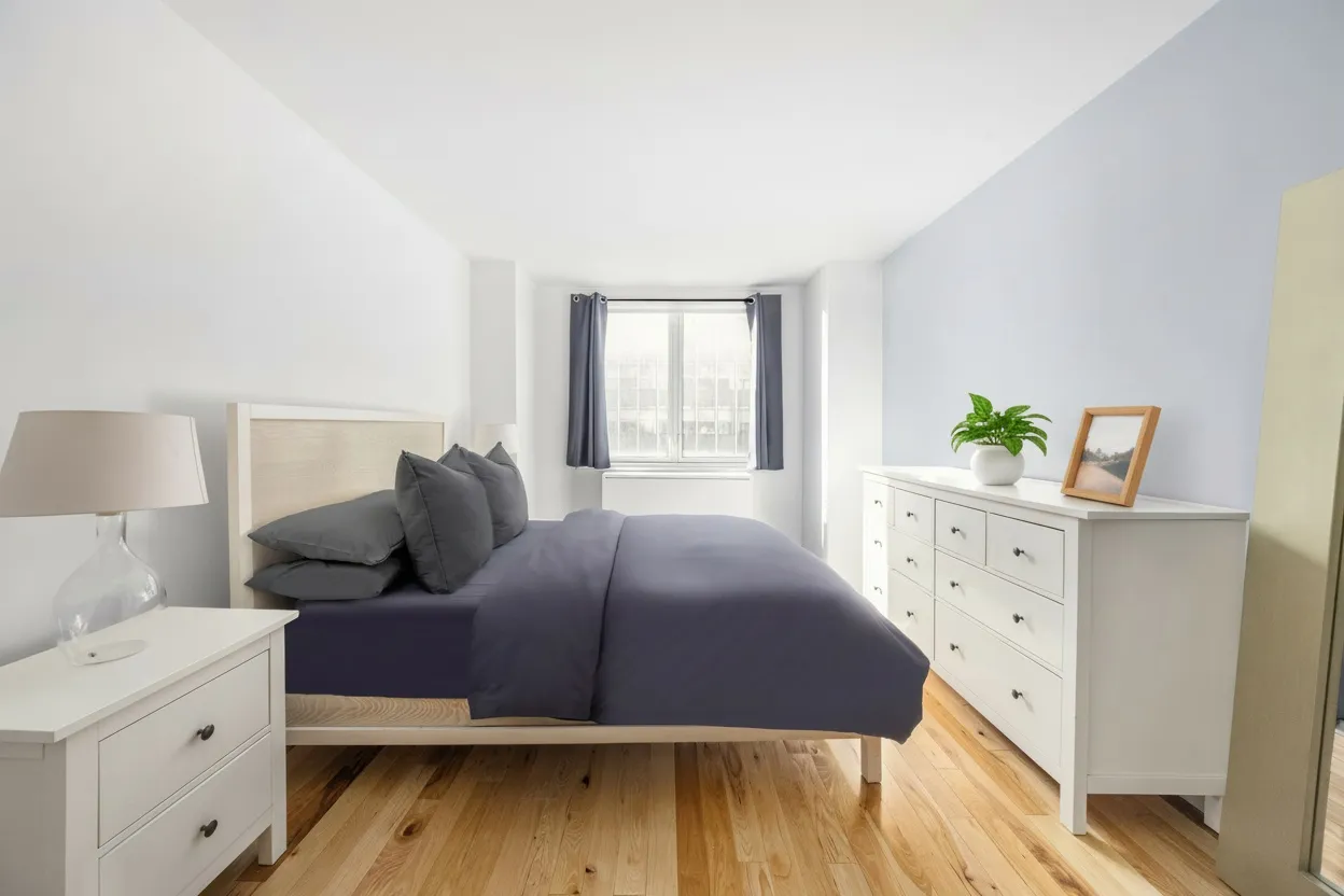 a bedroom with a bed and a dresser