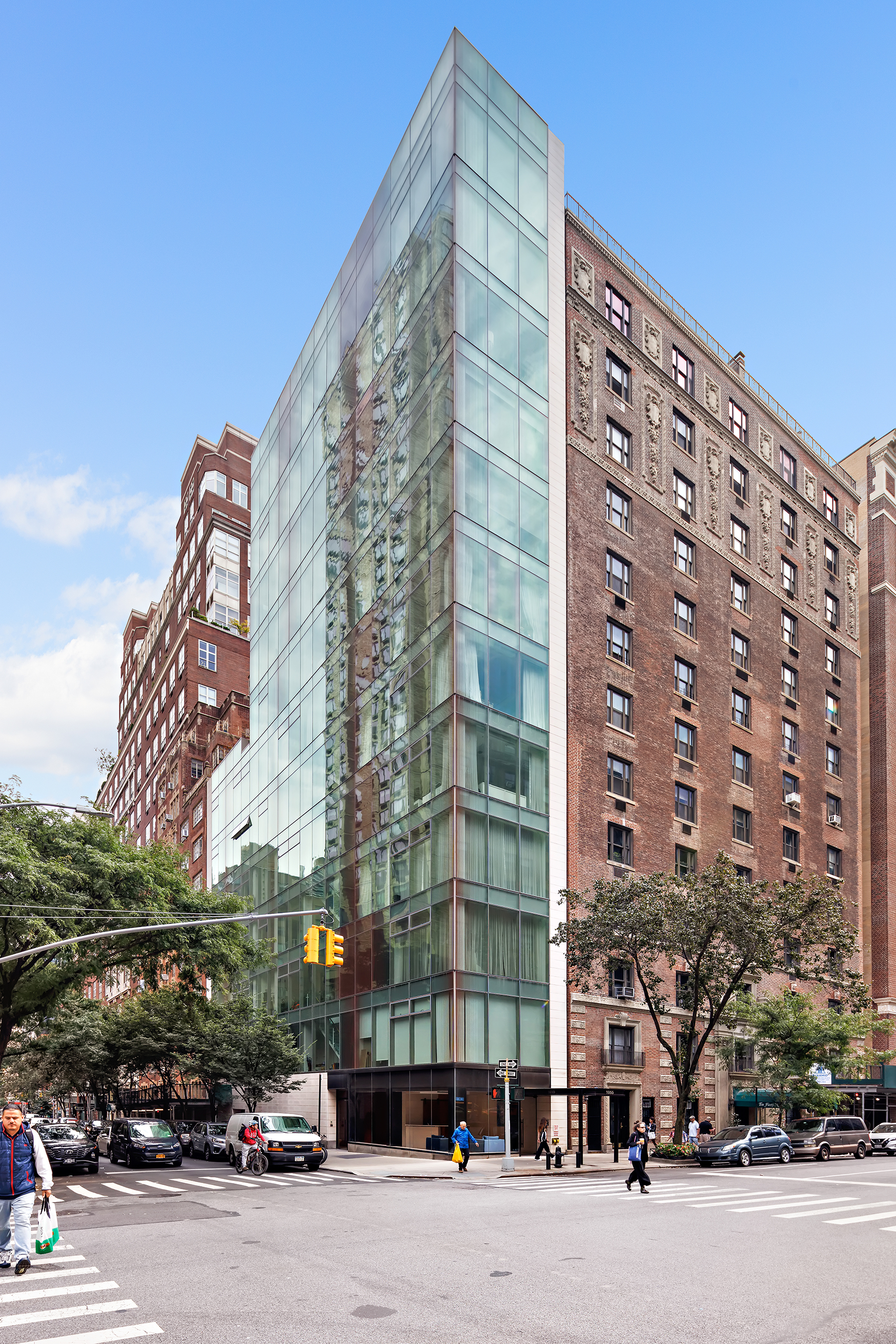 1055 Park Avenue, Unit 1 Manhattan, NY 10028 - Photo 18 of 19 front view of a building with a street