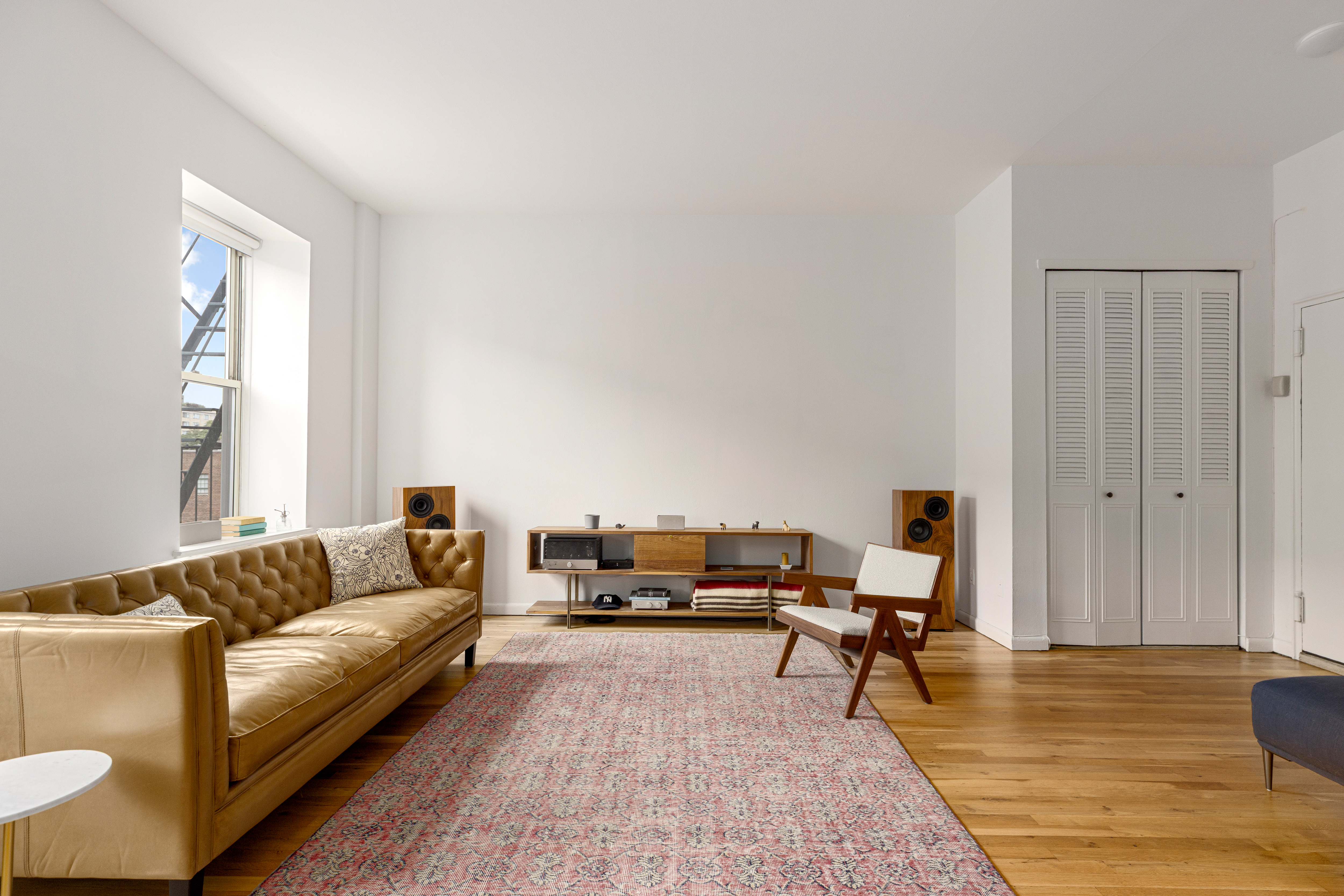 99 Bank Street, Unit 4R Manhattan, NY 10014 - Photo 2 of 15 a living room with furniture and wooden floor