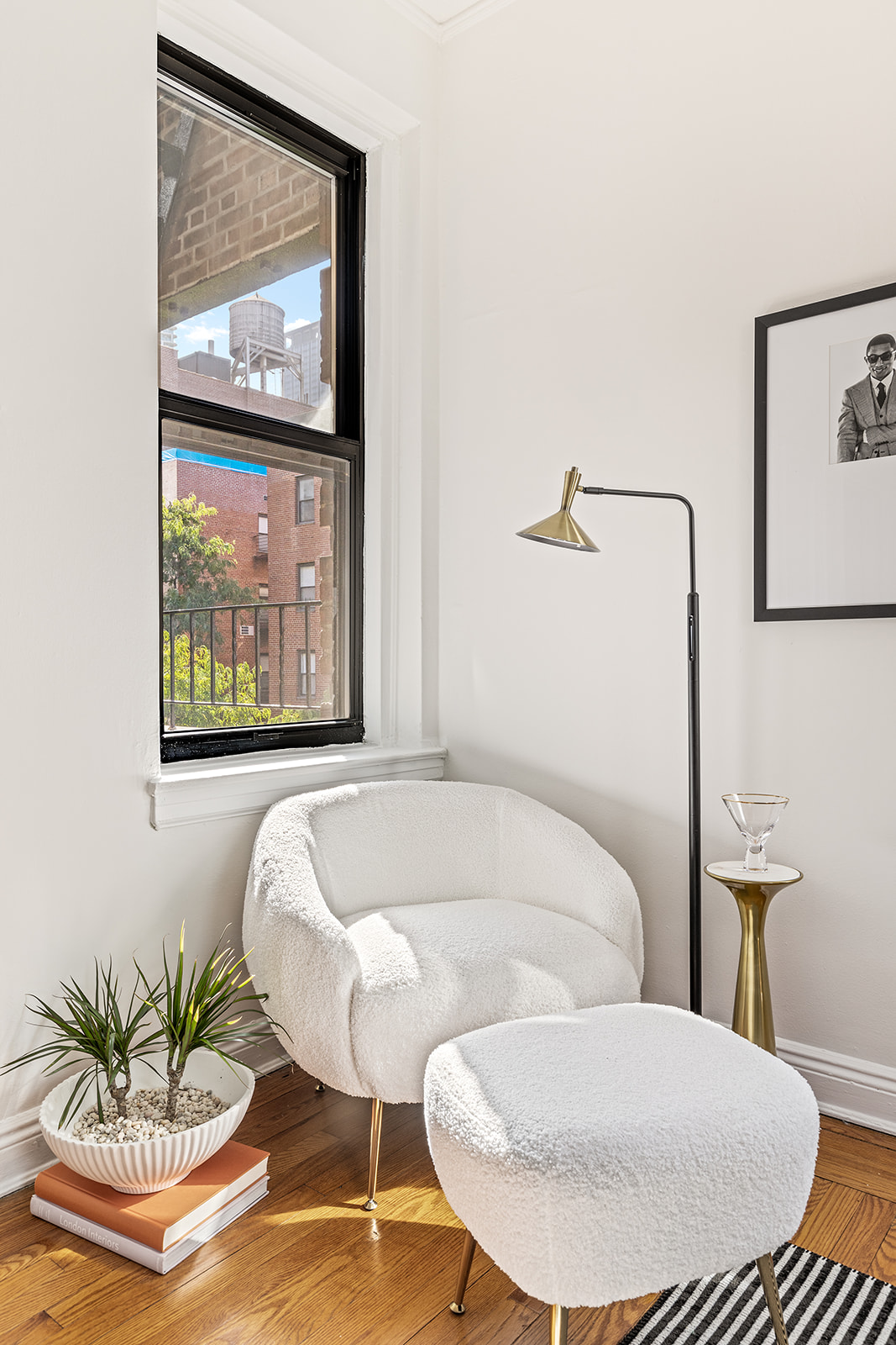 357 West 55th Street, Unit 4D Manhattan, NY 10019 - Photo 7 of 11 a bathroom with a couch and a painting on the wall