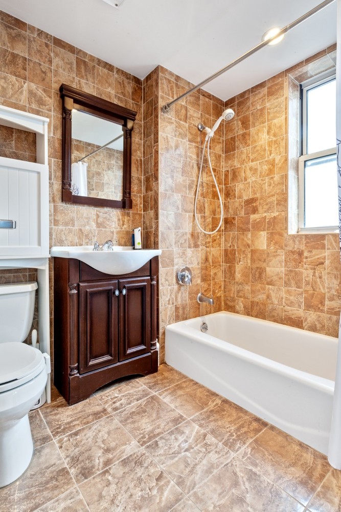 603 West 148th Street, Unit 10A Manhattan, NY 10031 - Photo 4 of 11 a bathroom with a sink and a mirror