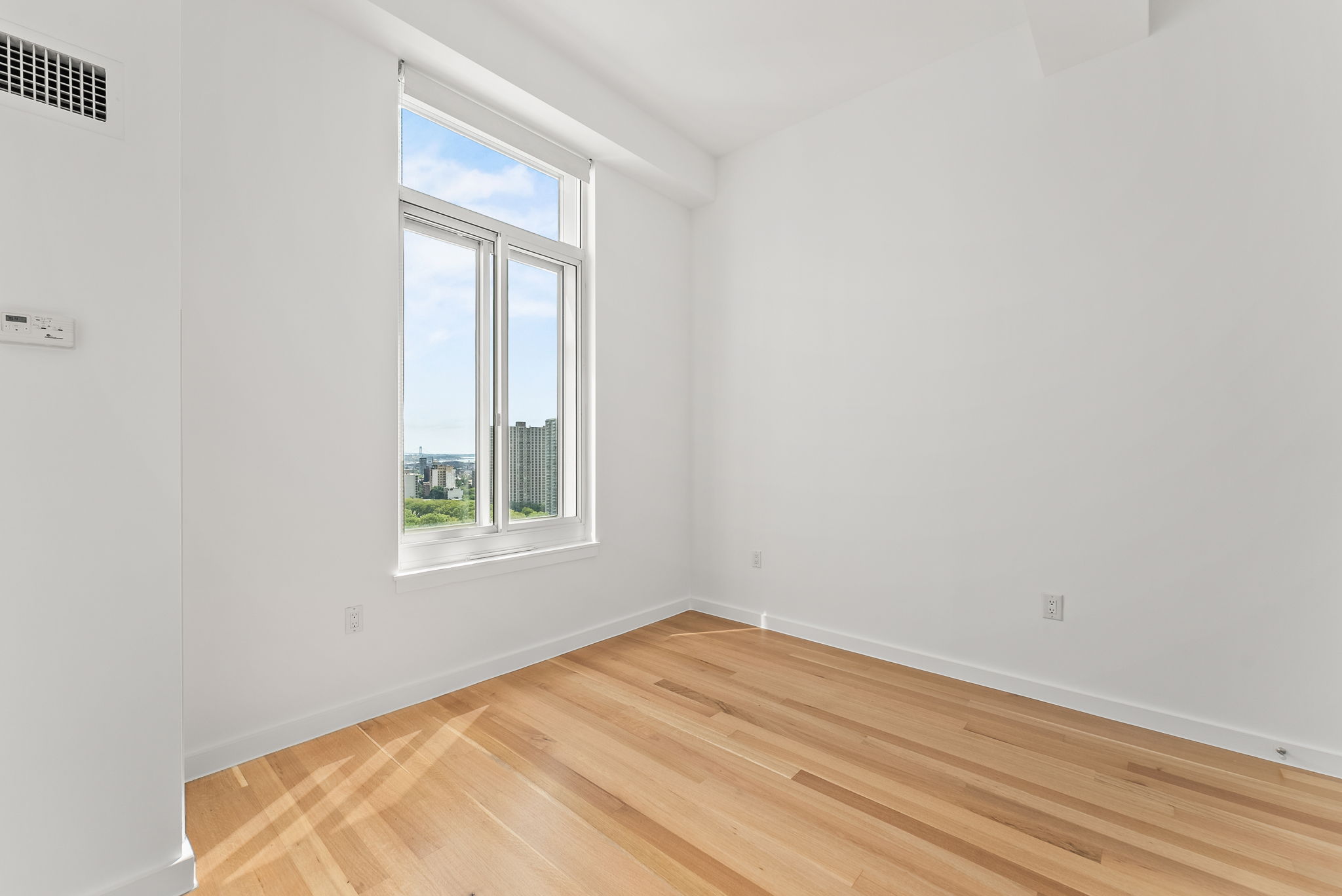85 Adams Street, Unit 21A Brooklyn, NY 11201 - Photo 10 of 18 an empty room with a window