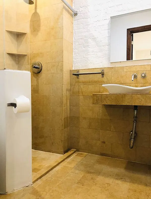 112 West 15th Street, Unit 2 Manhattan, NY 10011 - Photo 10 of 13 a bathroom with a sink a shower