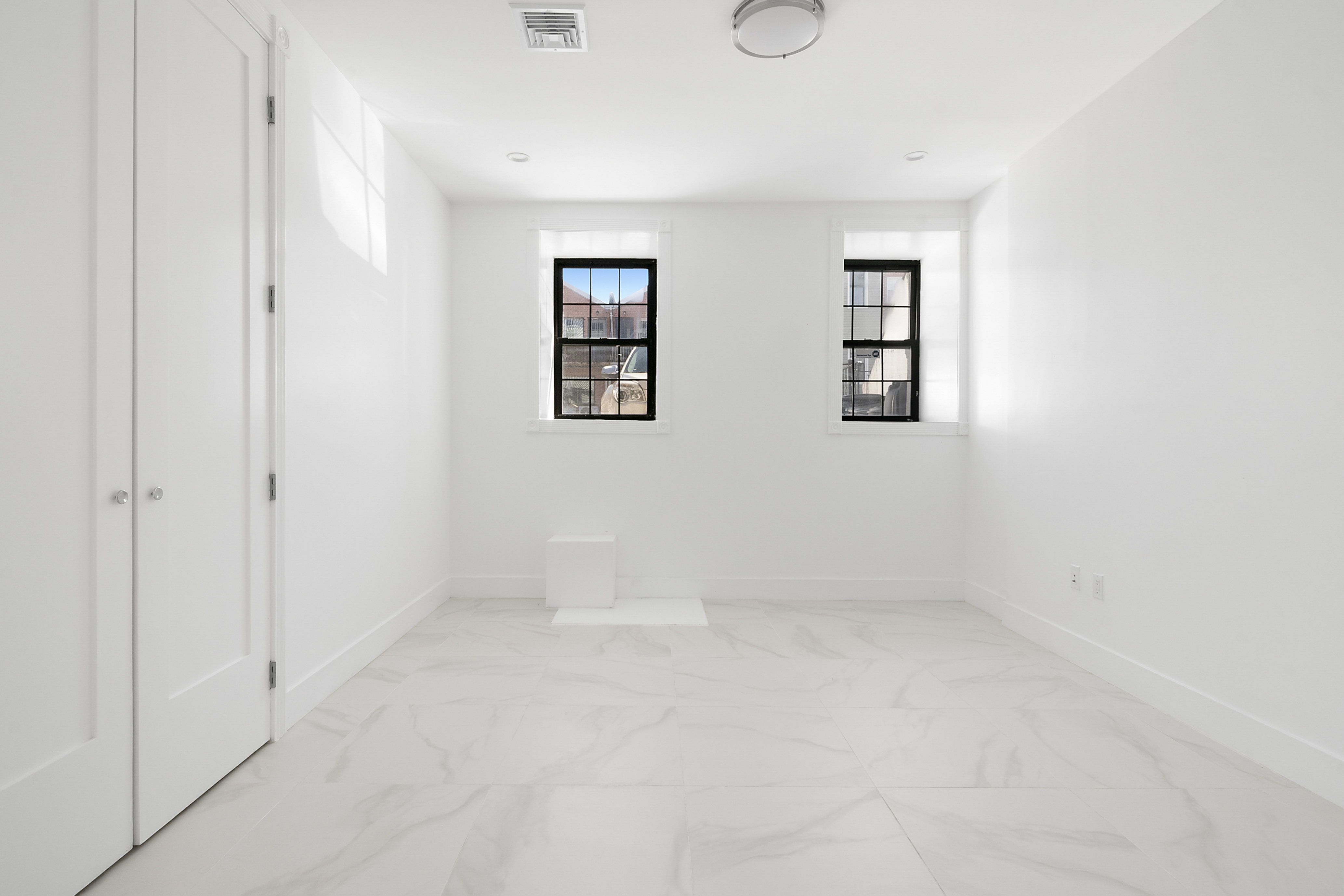 1085 Hancock Street Brooklyn, NY 11221 - Photo 5 of 9 an empty room with windows