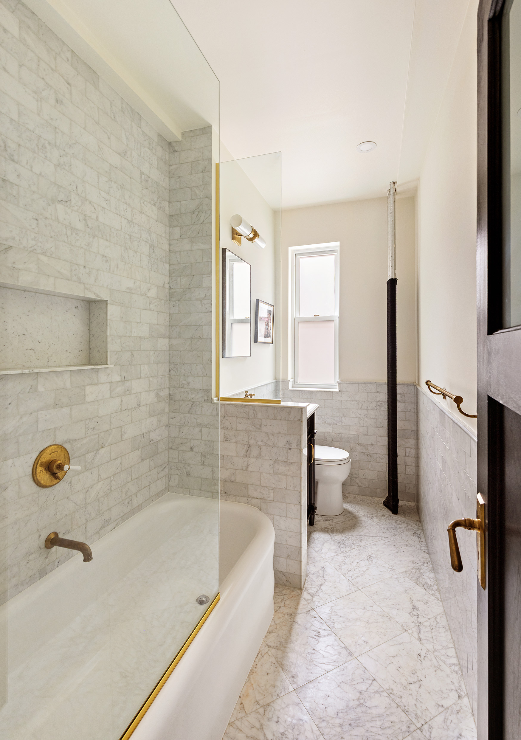 15 West 11th Street, Unit 3C Manhattan, NY 10011 - Photo 7 of 10 a bathroom with a bathtub and a shower