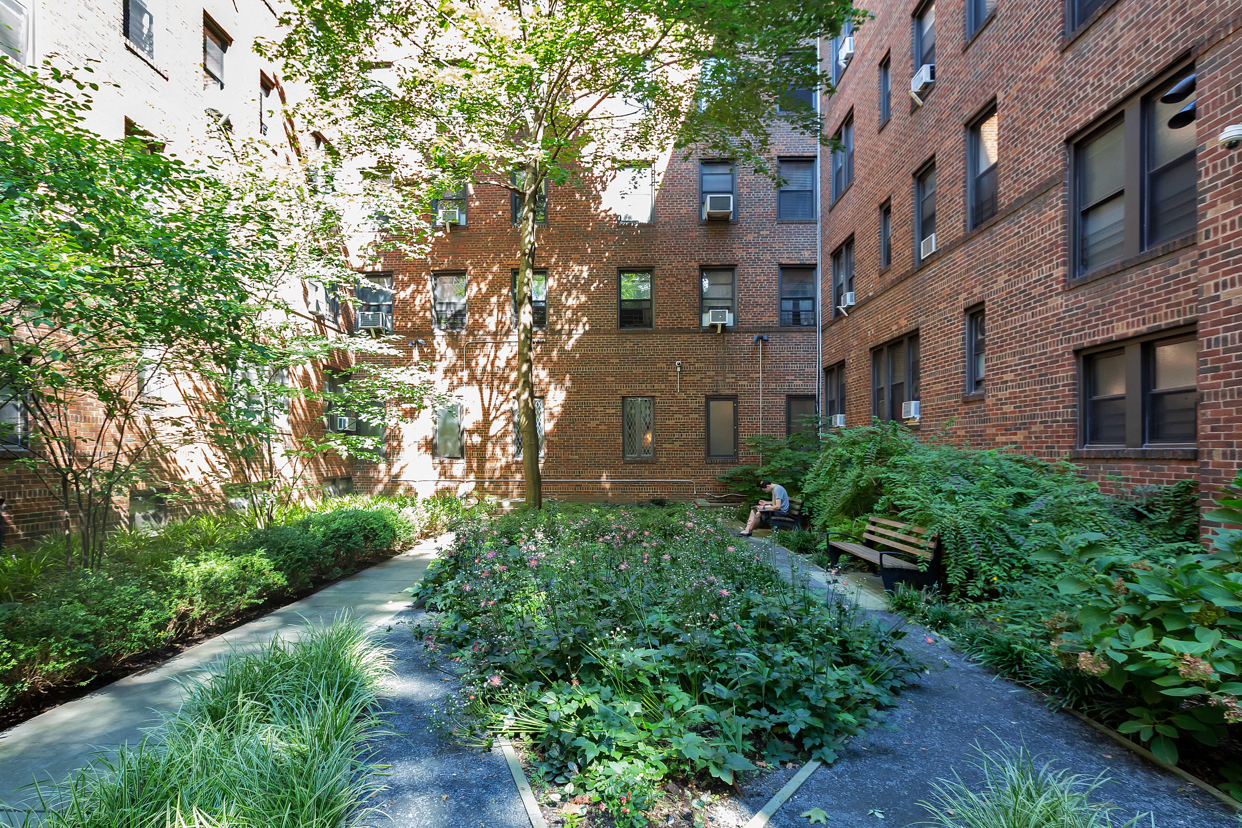 83-10 35th Avenue, Unit 3F Queens, NY 11372 - Photo 10 of 13 a view of a building with a yard